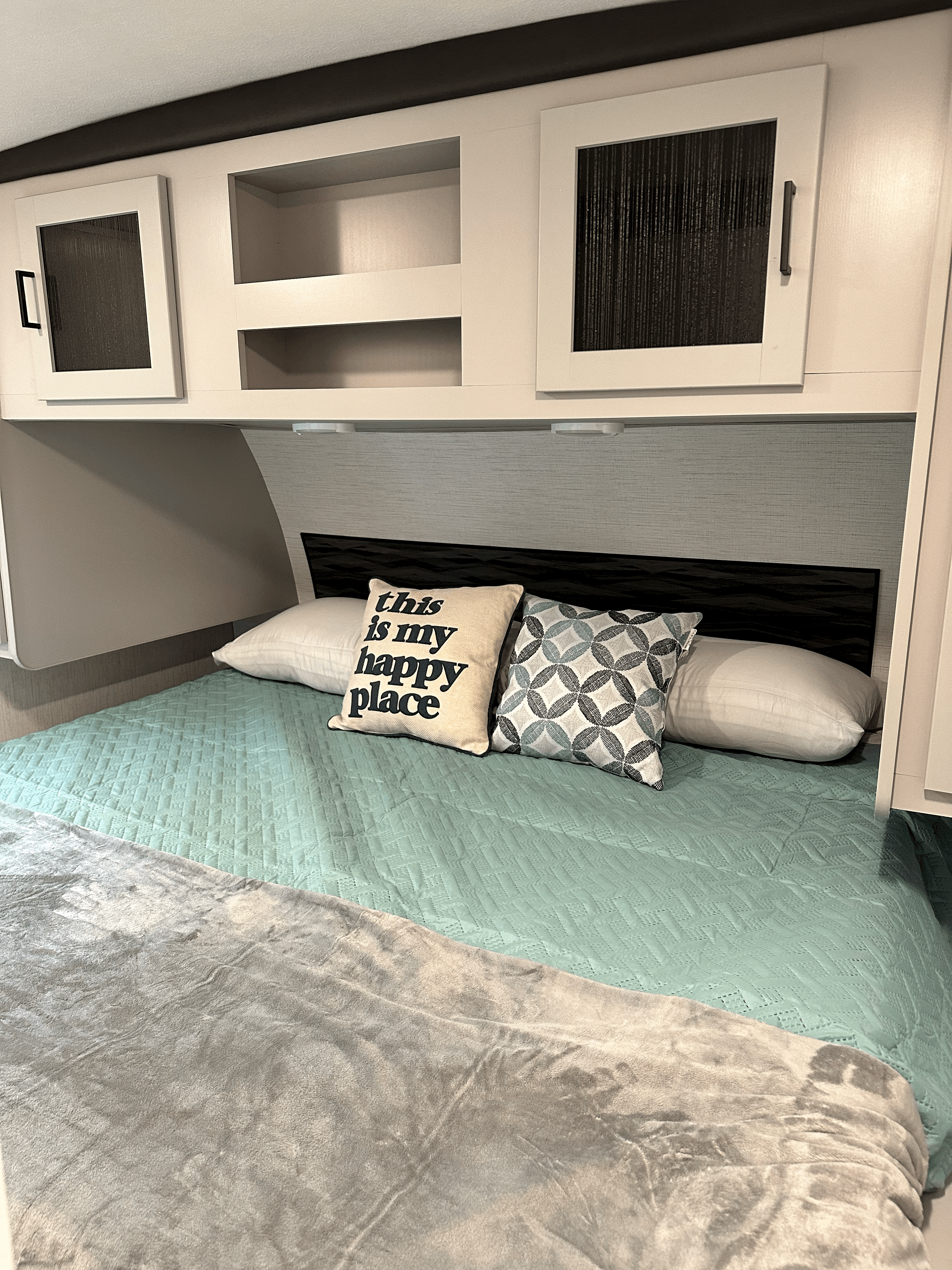 King-sized bed w/ two small closets, overhead, and under-bed storage. Two King-sized pillows, sheets, quilt, and throw included in all rentals.. Heartland RVs North Trail 2022