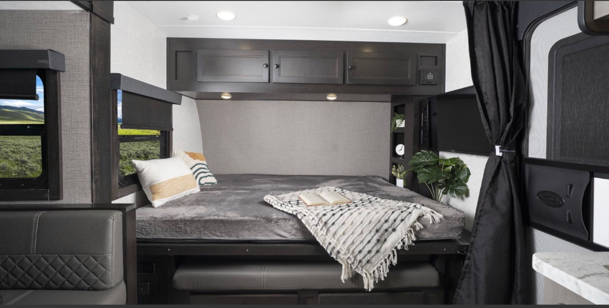 Comfortable RV rental interior: cozy bed, seating, and scenic views, ideal for travel adventures.. Starcraft Super Lite Maxx 2023