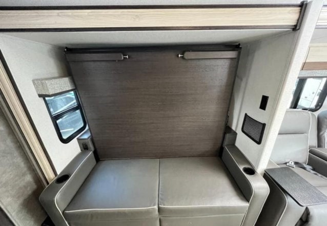 RV rental interior featuring a versatile murphy bed over a comfortable sofa, optimizing space.. Forest River Sunseeker MBS 2022