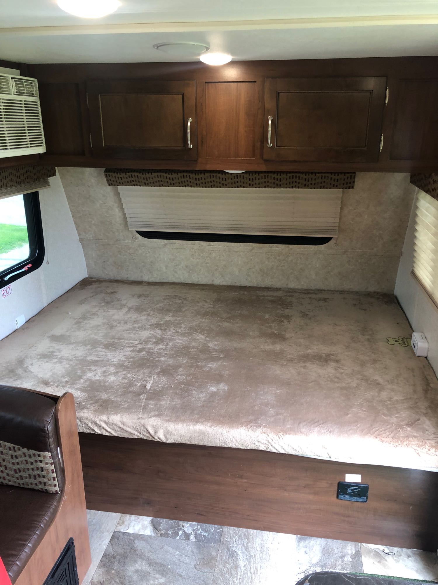Spacious RV rental sleeping area: large bed, overhead cabinets, AC, windows, ready for your next adventure.. Jayco Jay Flight SLX 2017