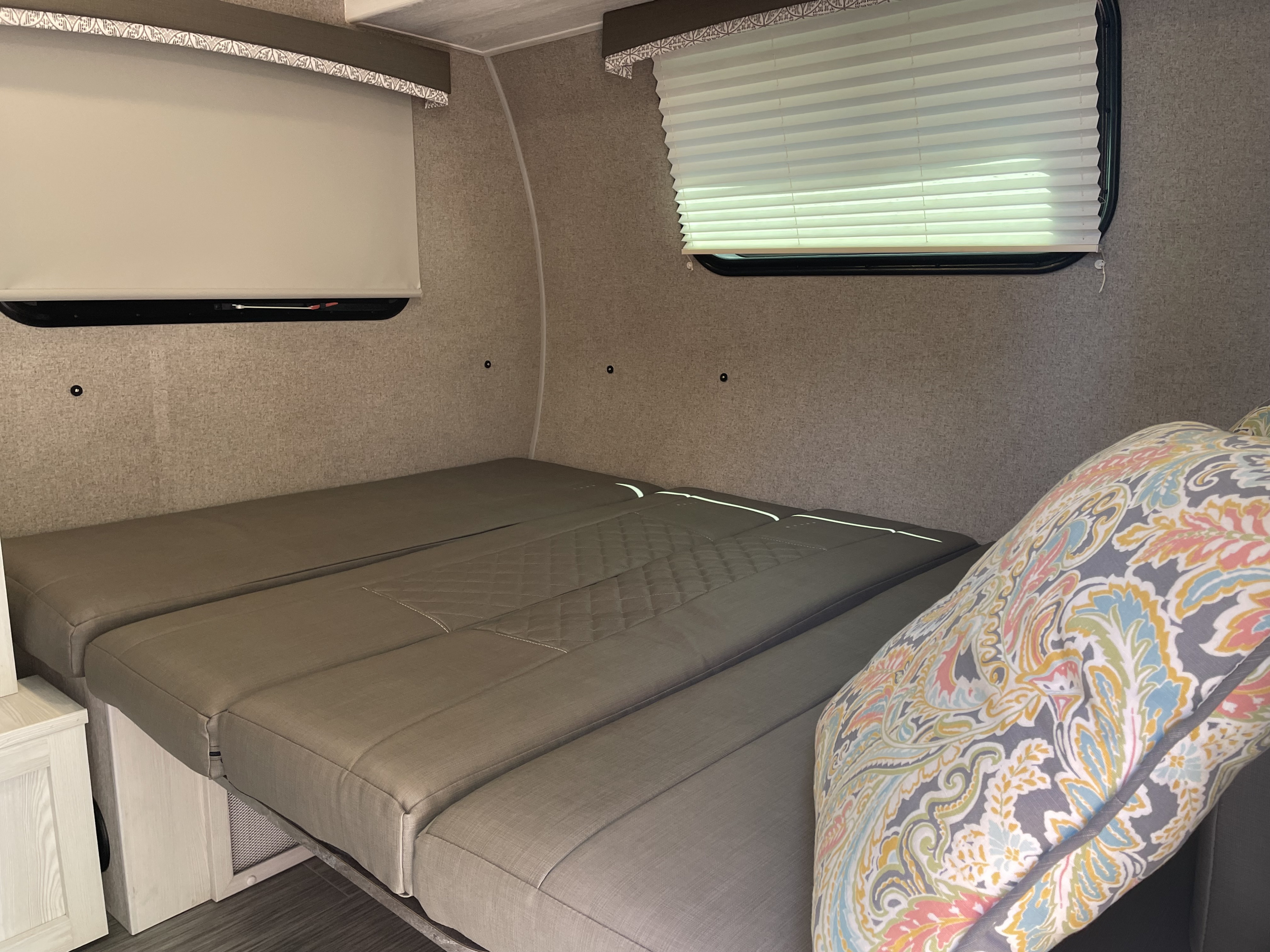 Tired? The kitchen table quickly and easily converts into a camping queen size bed.. Forest River Rockwood Geo Pro 2020