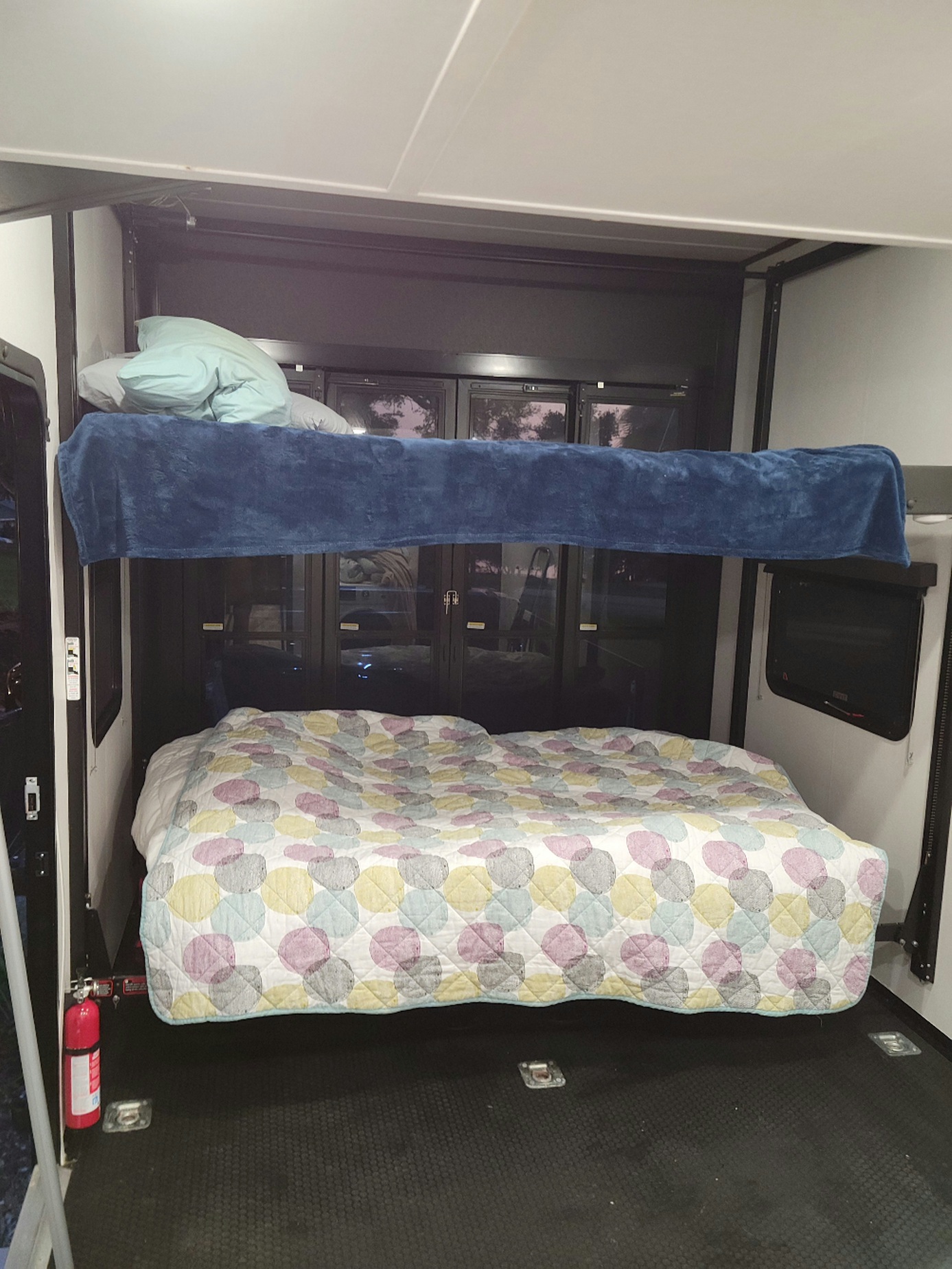 RV rental: Inside a toy hauler with power lift bunk beds. Dual sleeping areas provide comfort in this versatile space.. Forest River XLR Nitro Toy Hauler 2021