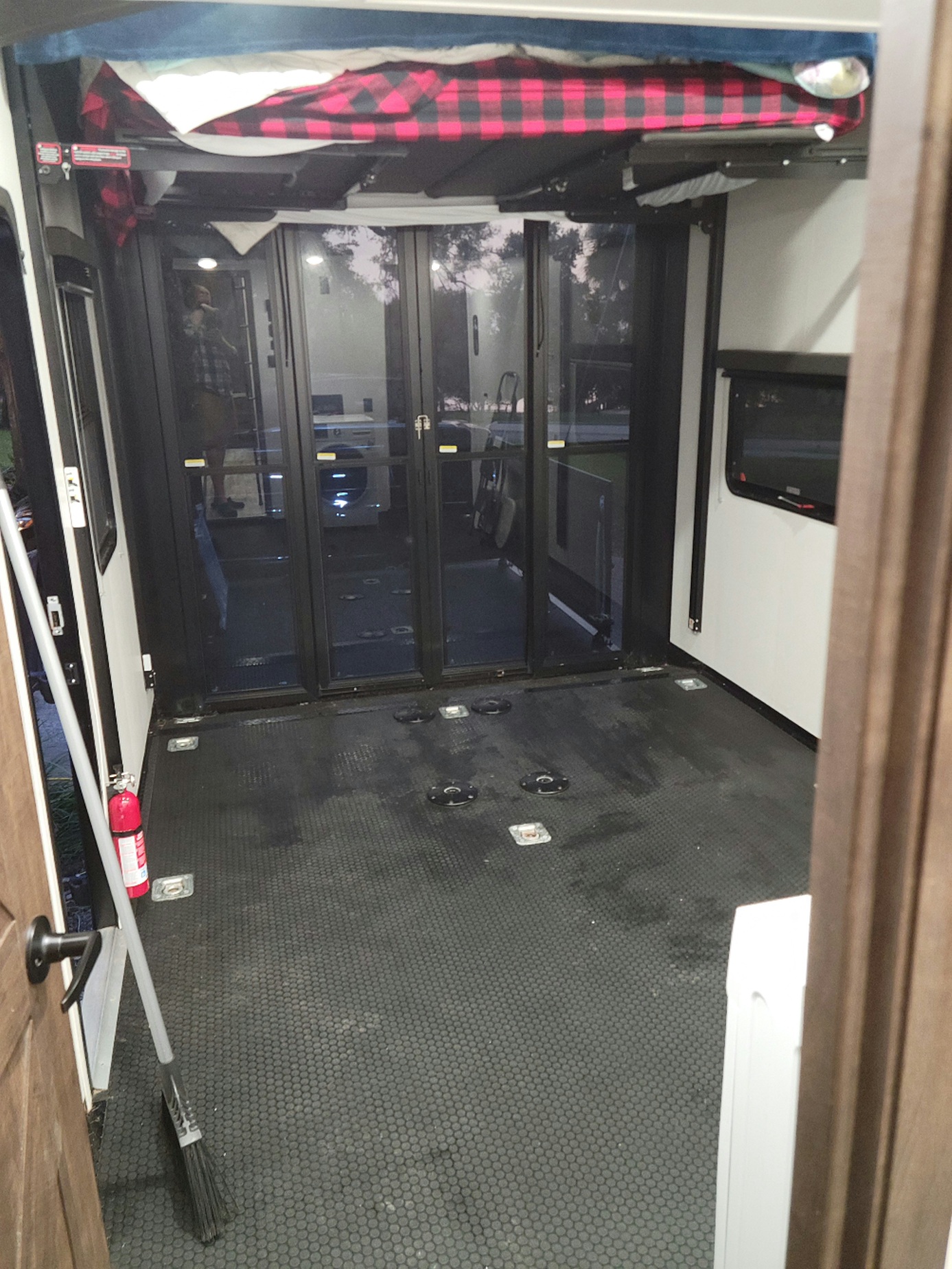 Explore this versatile RV rental toy hauler's spacious garage area, featuring a raised bed, large rear doors, and floor tie-downs.. Forest River XLR Nitro Toy Hauler 2021