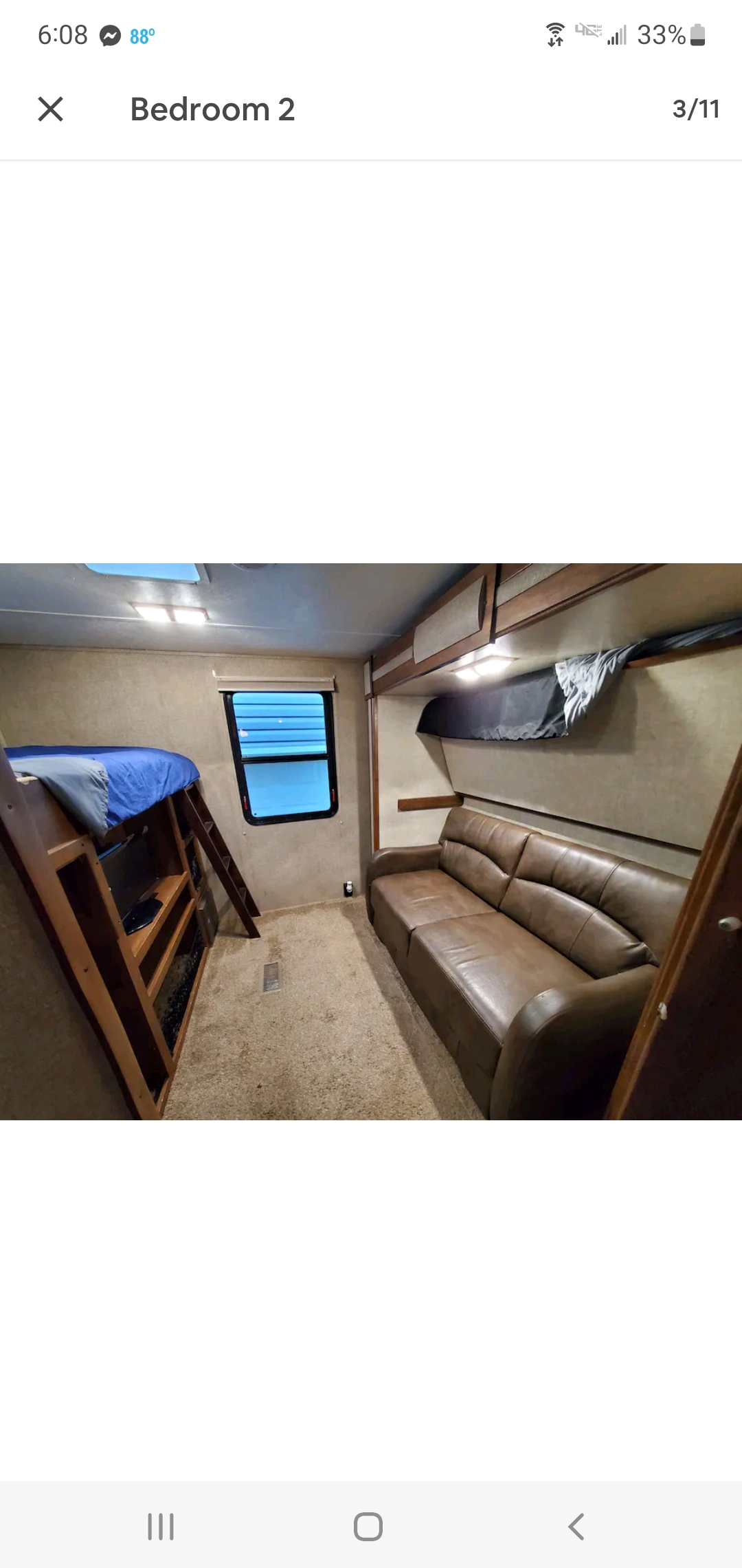 This RV rental's second bedroom features bunk beds, a brown sofa, and a window. Ideal for families.. Keystone Sprinter 2014