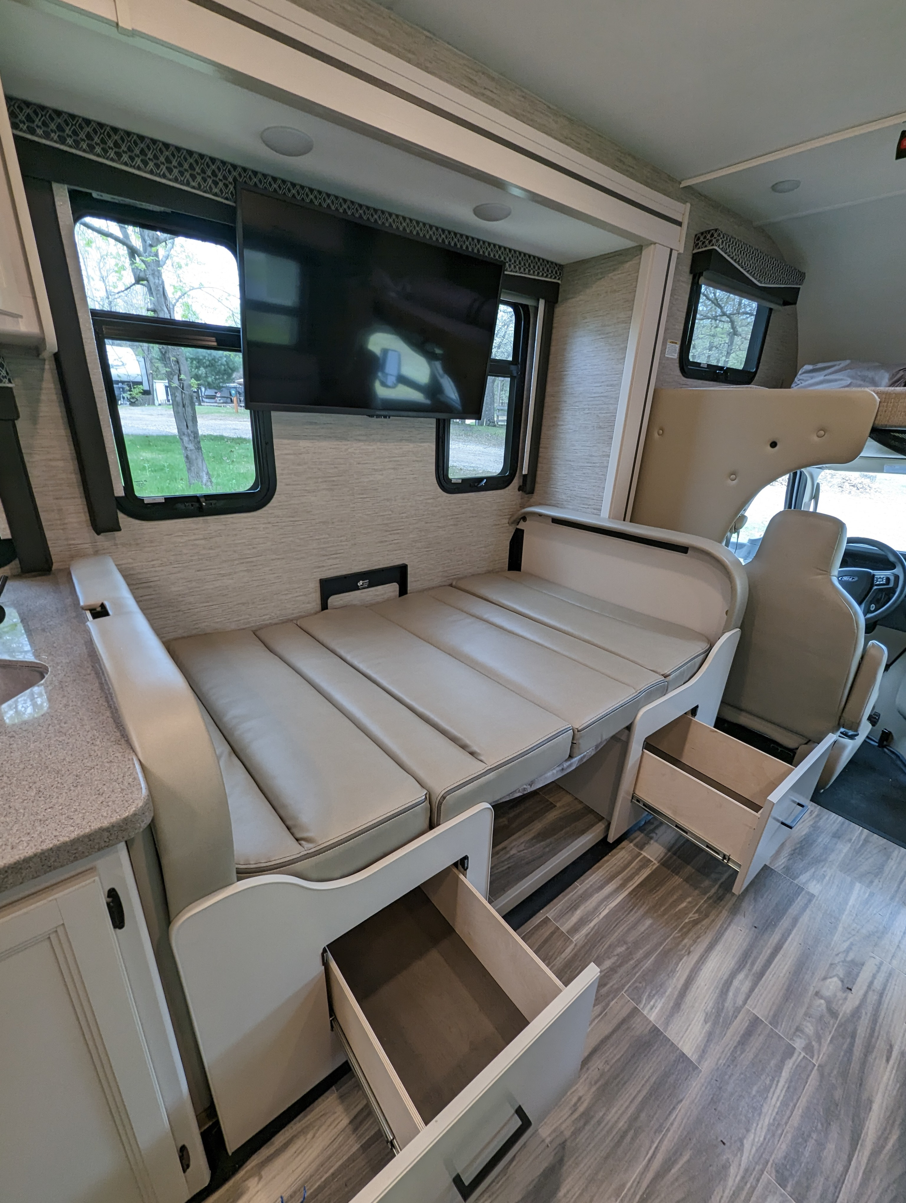 Kitchen table breaks down to a bed for two. Thor Four Winds 2023