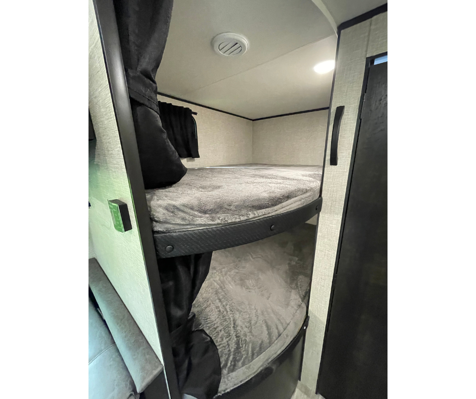 RV rental: Cozy interior featuring two bunk beds with soft grey bedding, perfect for family adventures.. Jayco Jay Flight SLX 2022