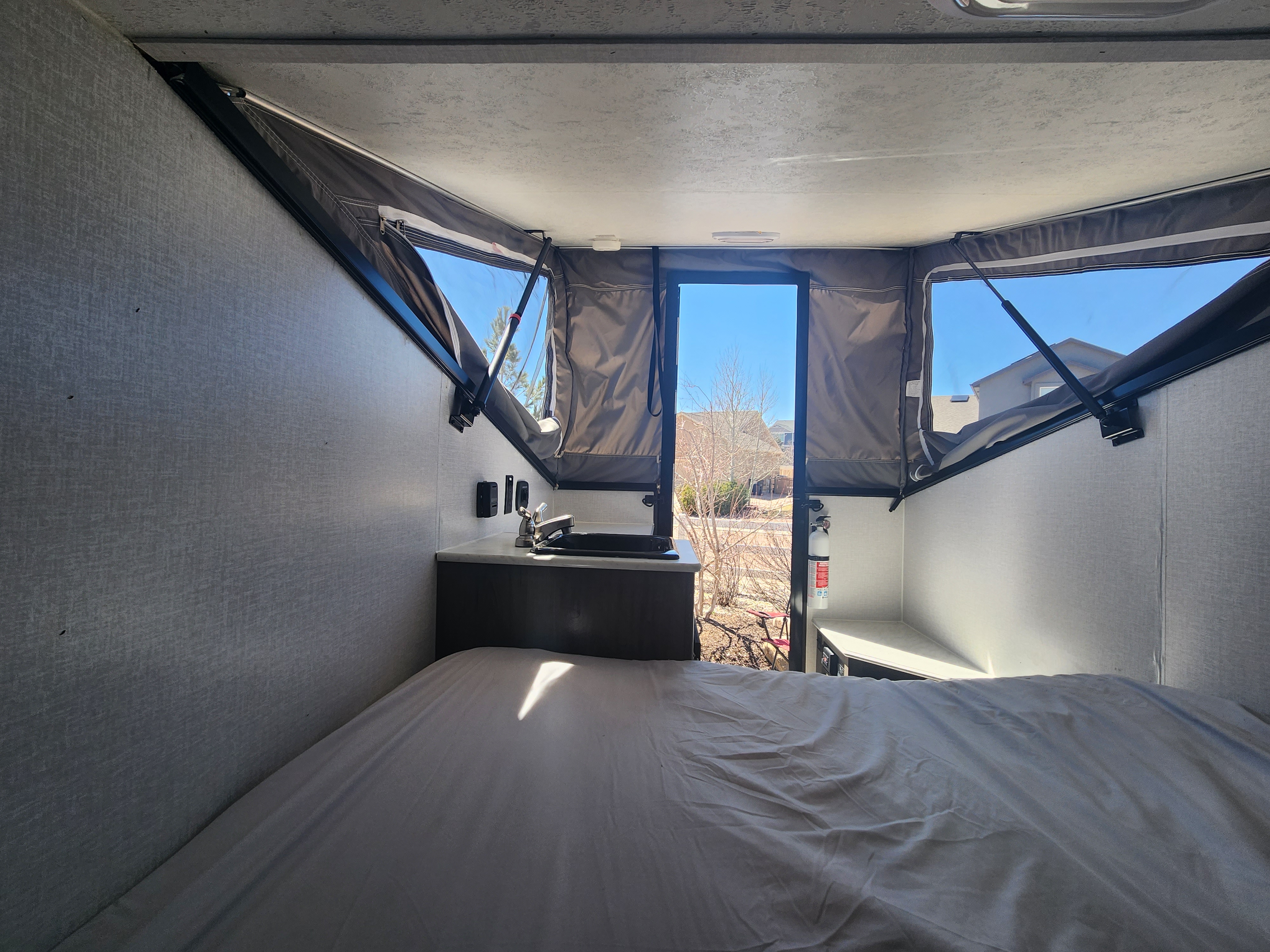 Full bed sleeps two adults and maybe a small child or dog. This trailer has AC and heat, as well as a water heater for the outside shower connections.. Forest River Viking TD 2022