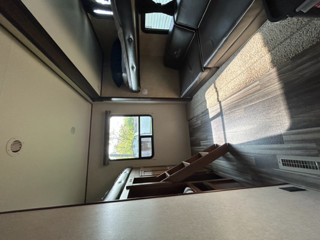 Explore this bright RV rental interior with bunk beds, comfy couch, and steps to a lower level. Natural light streams in.. Jayco Jay Flight SLX 2017