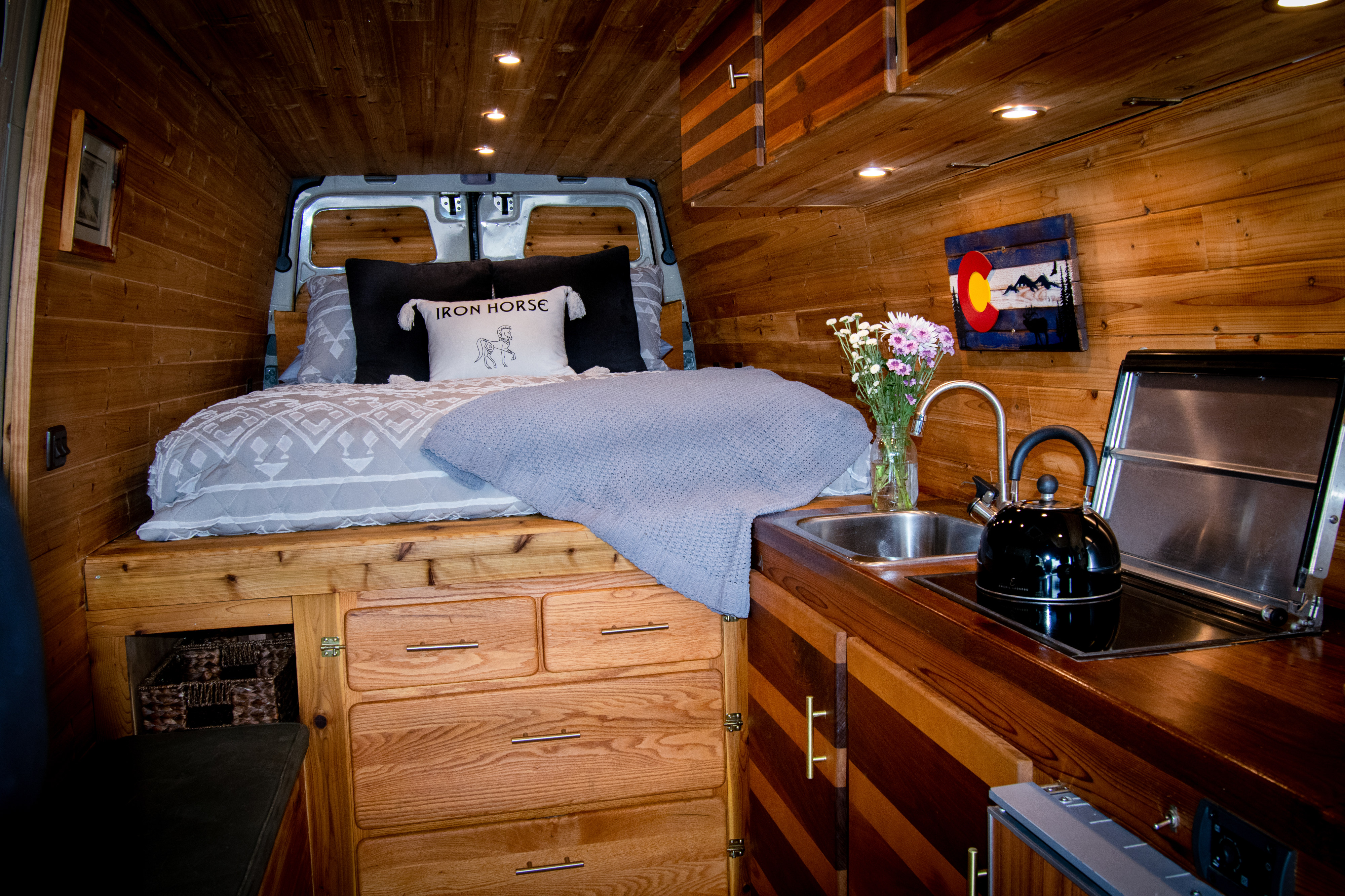 Explore in comfort! This cozy rv rental boasts a custom wood interior with a bed, kitchen, and ample storage.. Mercedes-Benz Sprinter 2500 2016