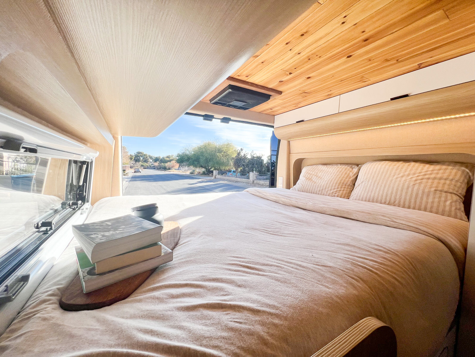 A memory foam bed with an A/C unit to keep you cool in the summer months. . Dodge Ram Promaster 3500 2022