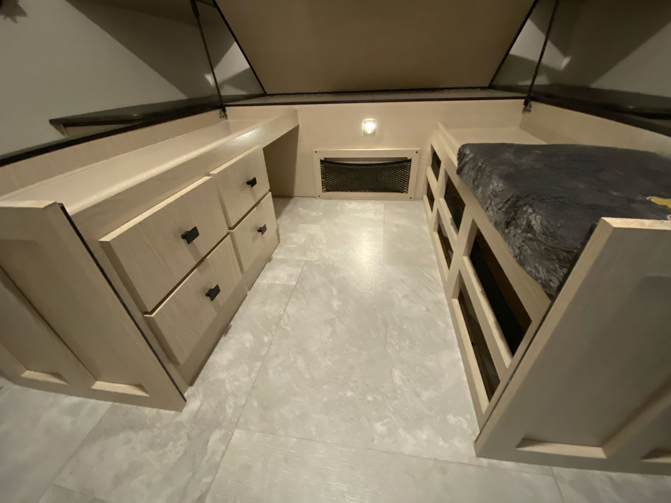 RV rental interior: A compact sleeping area with a cozy bunk bed and ample storage drawers.. Forest River Coachmen Apex 256BHS 2022