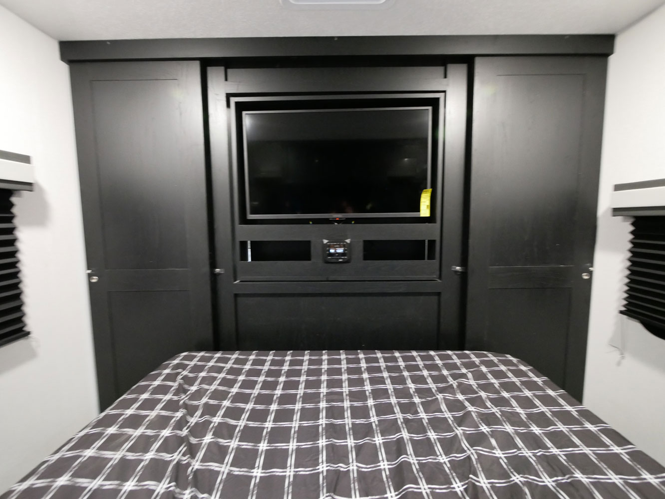 RV rental bedroom: Features built-in storage, TV, and a comfortable bed for a great journey.. Coachmen 257BHS 2022