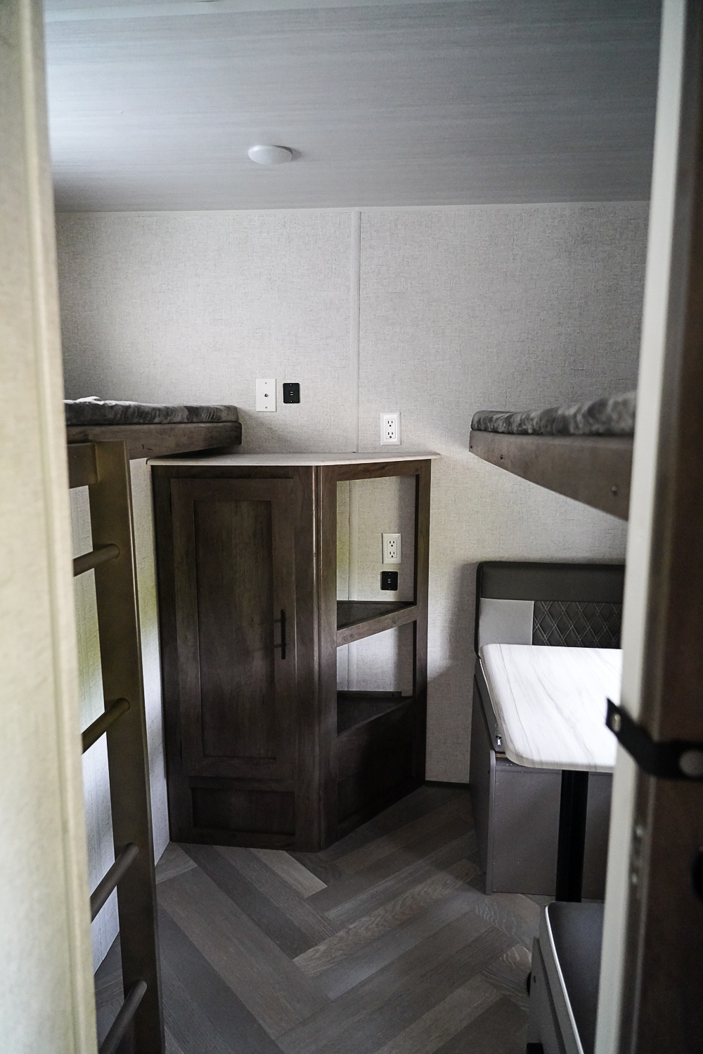 Private Bunkhouse. The right bottom bunk does convert to either a bed or a seating area. The bunkhouse contains three twin beds.. Forest River Wildwood 2021