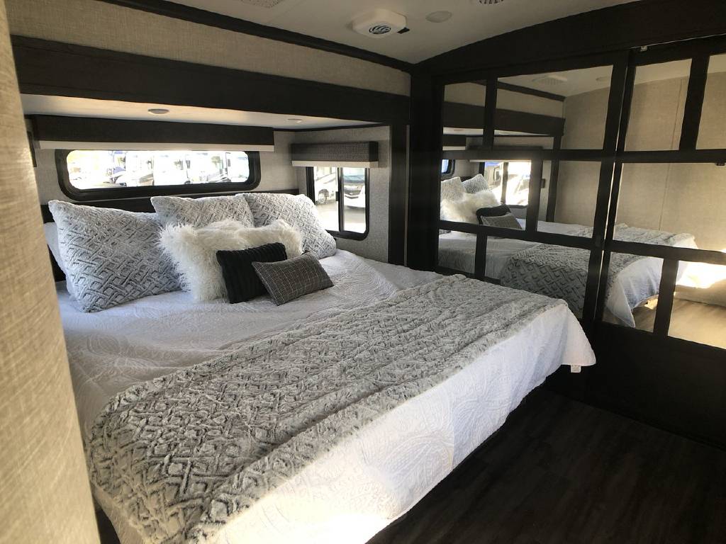 Experience comfort in this RV rental bedroom.. Jayco North Point 2022