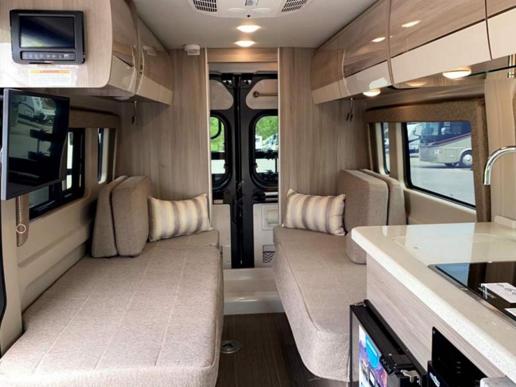 This rv rental offers a comfortable interior with twin benches, a kitchen, and TV. Perfect for your next adventure.. Thor Sequence 2020
