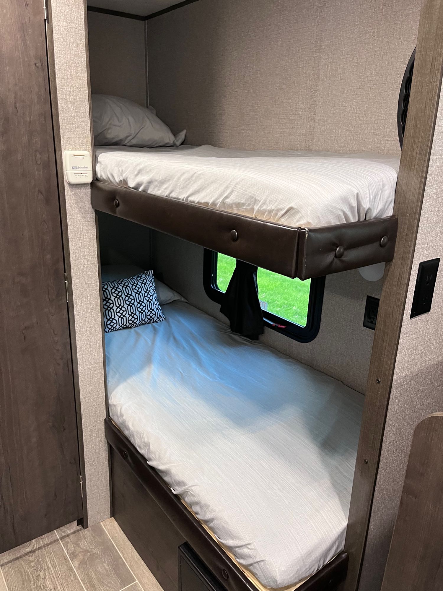 Cozy RV rental bunk beds offer comfortable sleeping in this camper's interior, ideal for travel adventures.. Jayco Jay Flight 2021