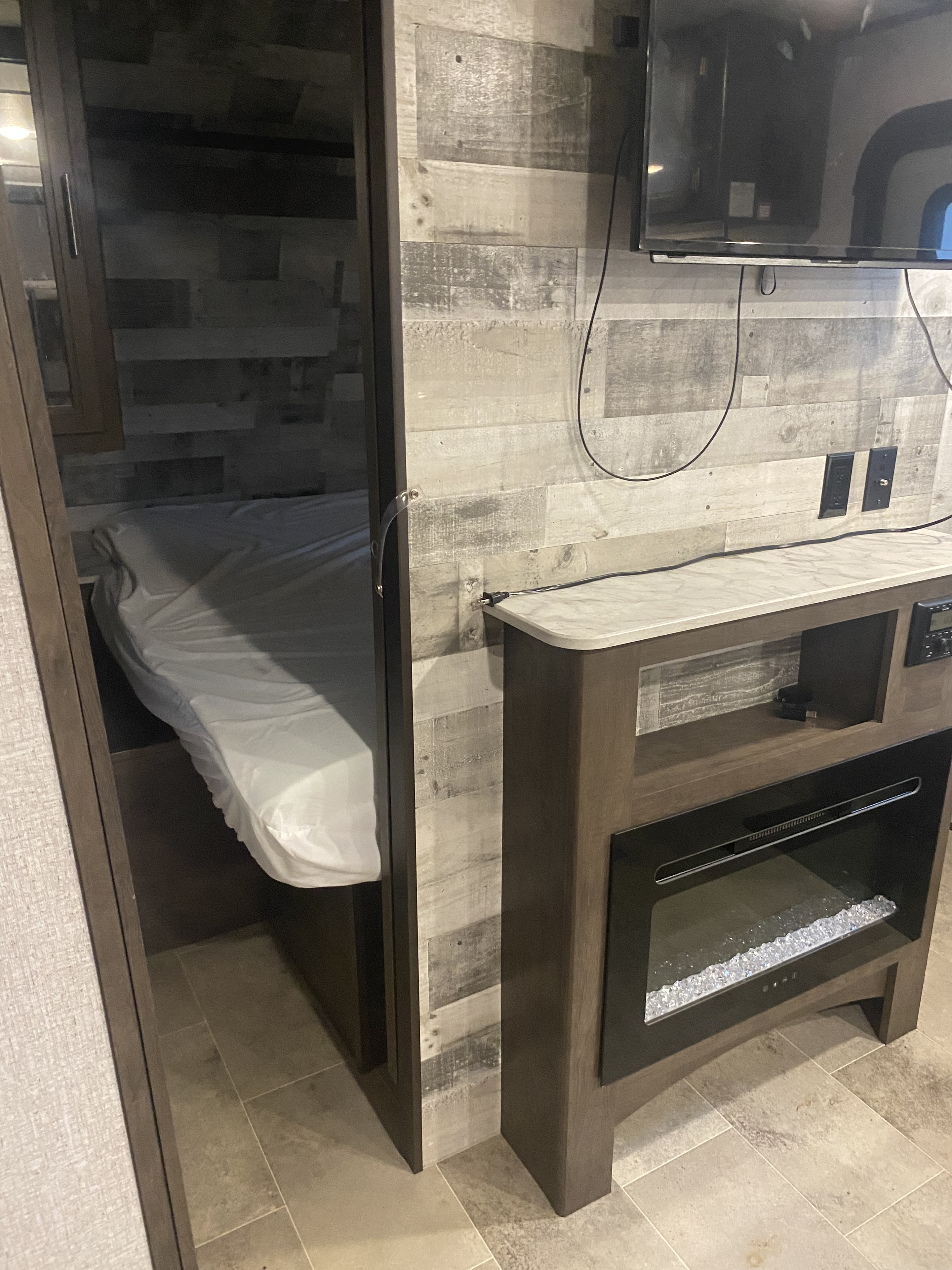 Doorway to bedroom with RV queen bed. . Dutchmen Coleman Lantern 2021