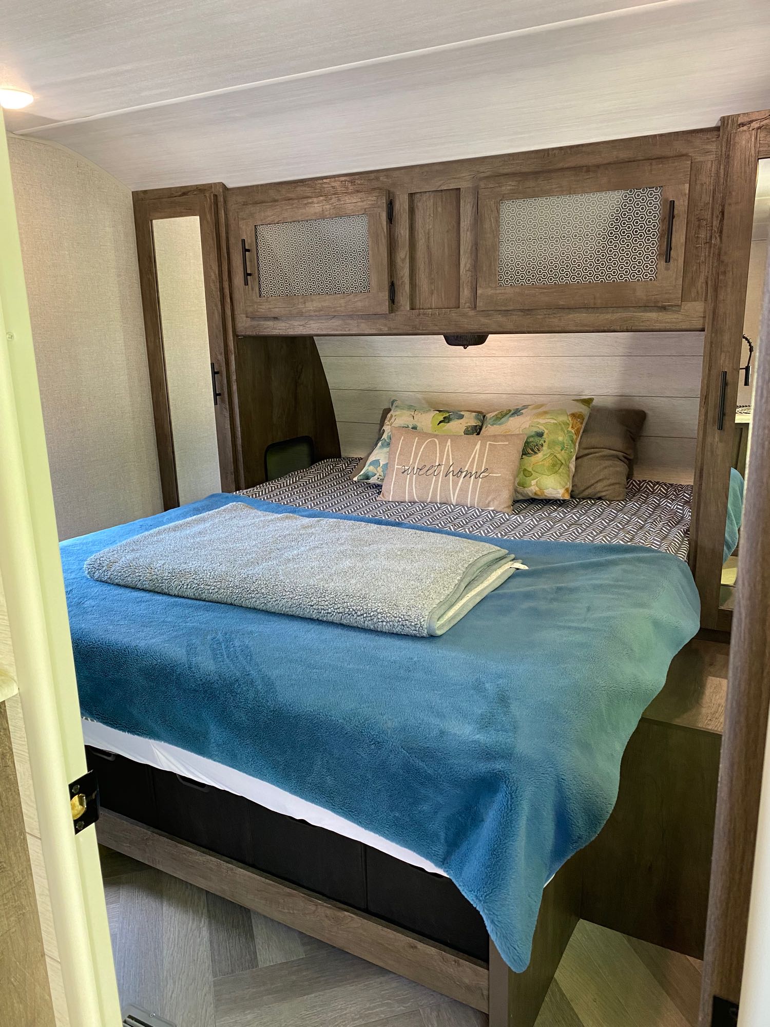 First glance inside the cozy primary bedroom. . Forest River Wildwood 2021