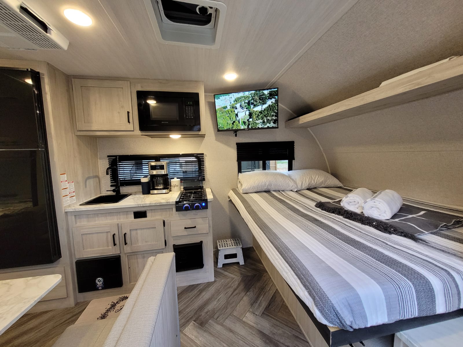 Cozy RV rental interior. East to West Della Terra 2023
