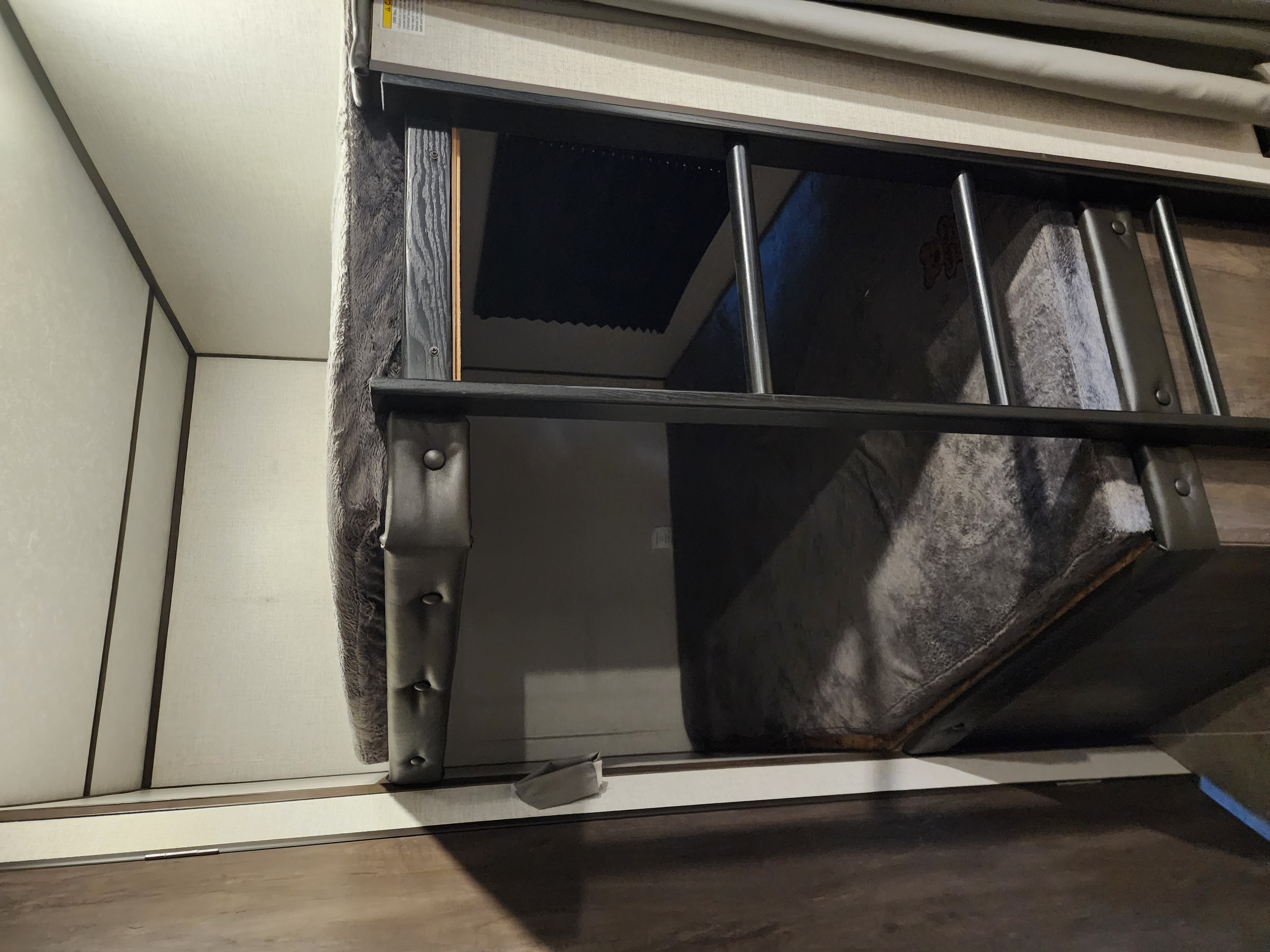 RV rental interior: A practical bunk bed with a secure ladder, offering extra sleeping space.. Coachmen lantern Dutchman 263 BHWE 2021