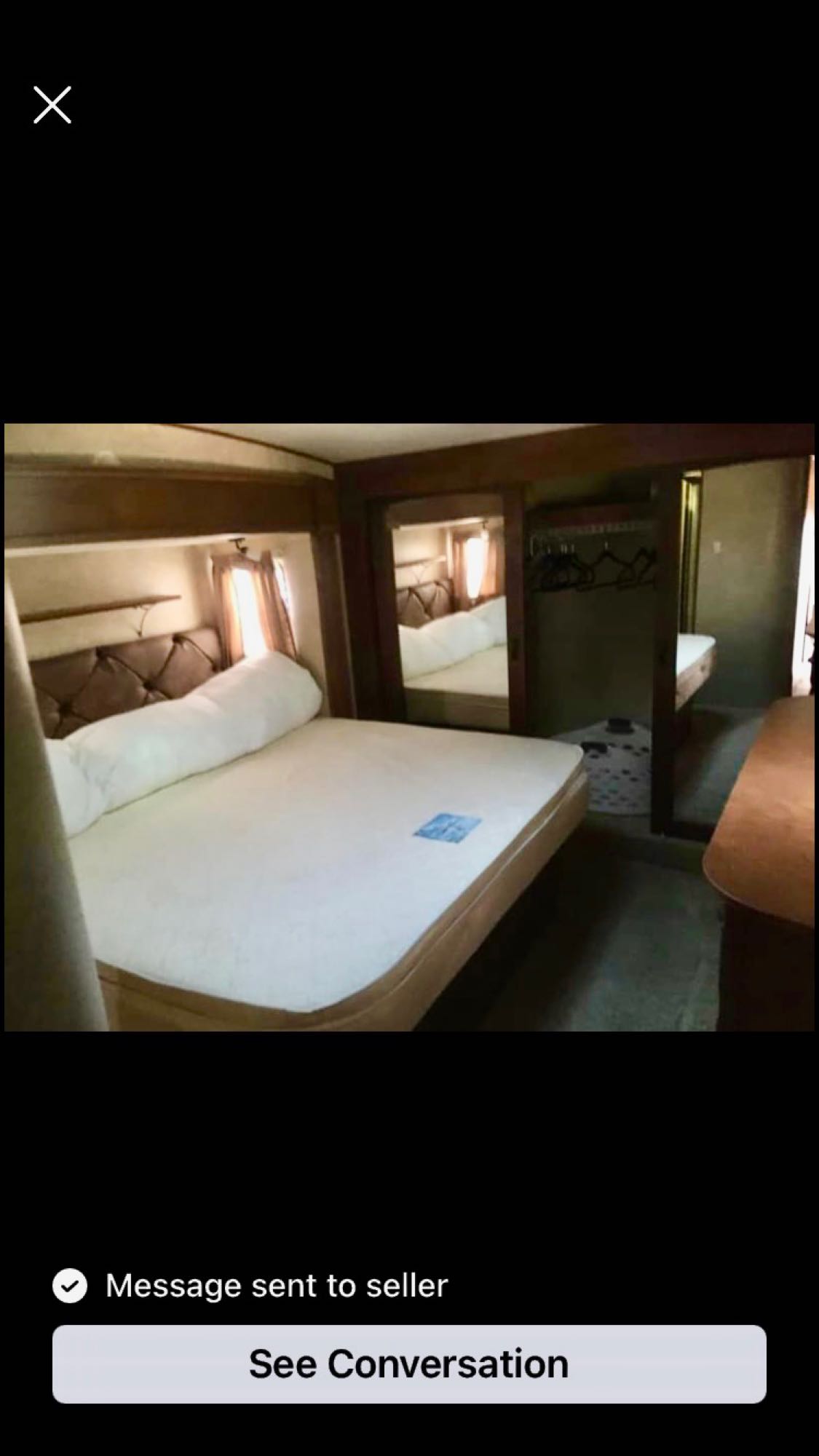 RV rental: An interior view of a clean RV bedroom, featuring a large bed with a tufted headboard and mirrored closet.. Open Range RV Open Range RV Fifth Wheel 2013