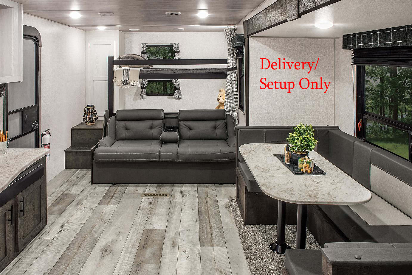Modern RV rental interior: cozy dinette, kitchen, sofa, and bunk beds. Perfect family living space with delivery/setup.. KZ 281BHSE 2022