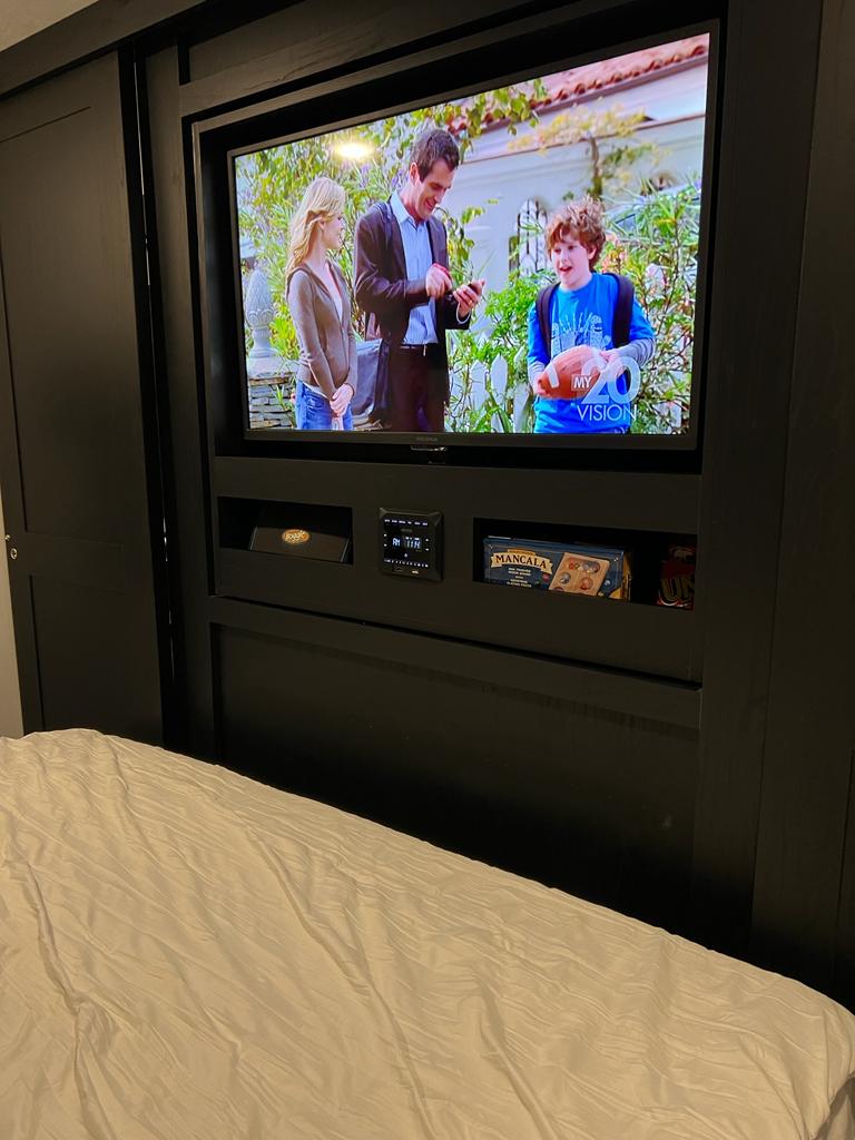 Cozy RV rental bedroom with a wall-mounted TV and entertainment area. Ideal for travel comfort.. Coachmen Freedom Express Ultra Lite 257BHS 2022