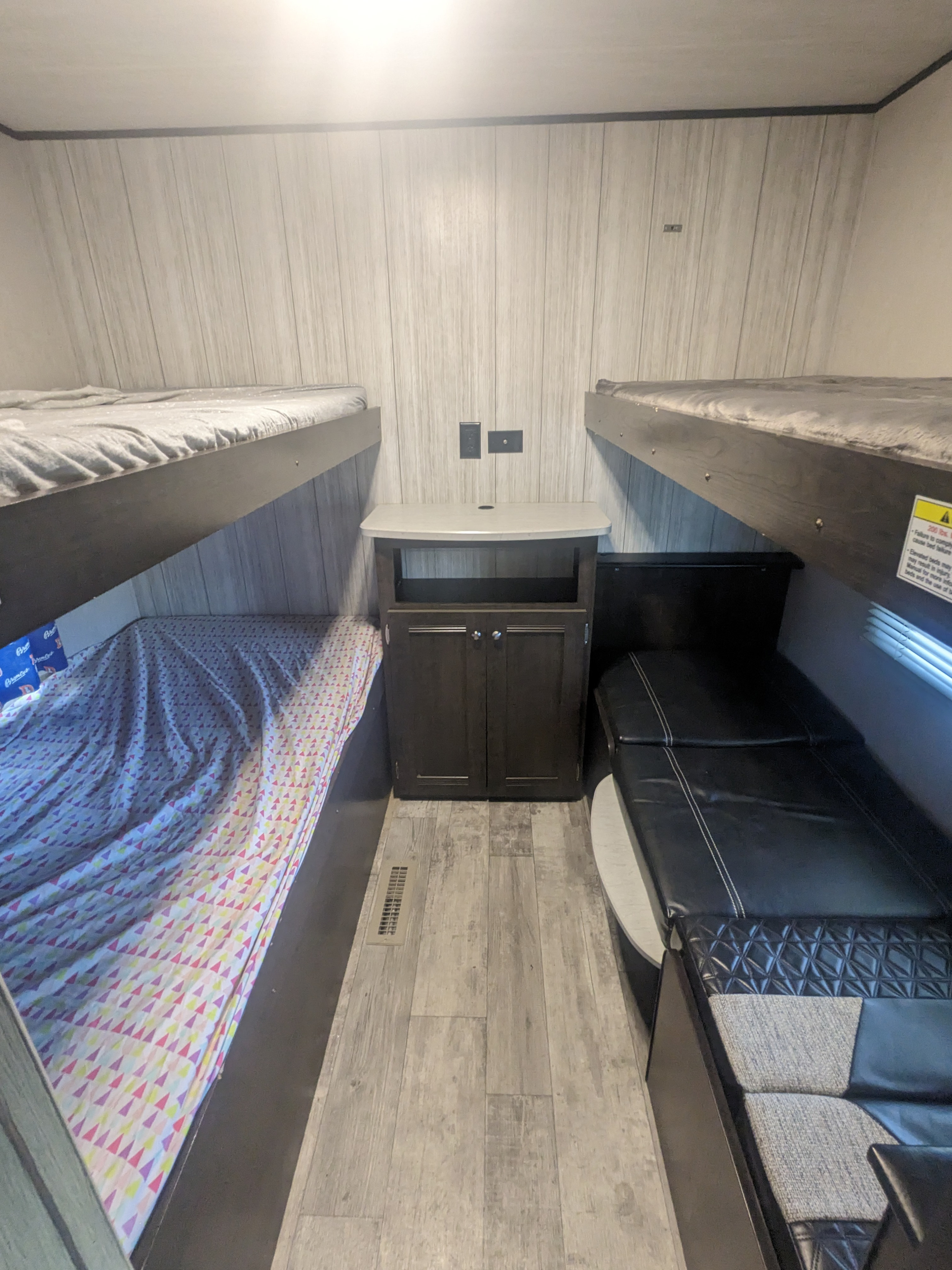 Quad rear bunkhouse, bottom right also sets up into a dinette and top bunk folds up out of the way. Heartland RVs Pioneer 2020