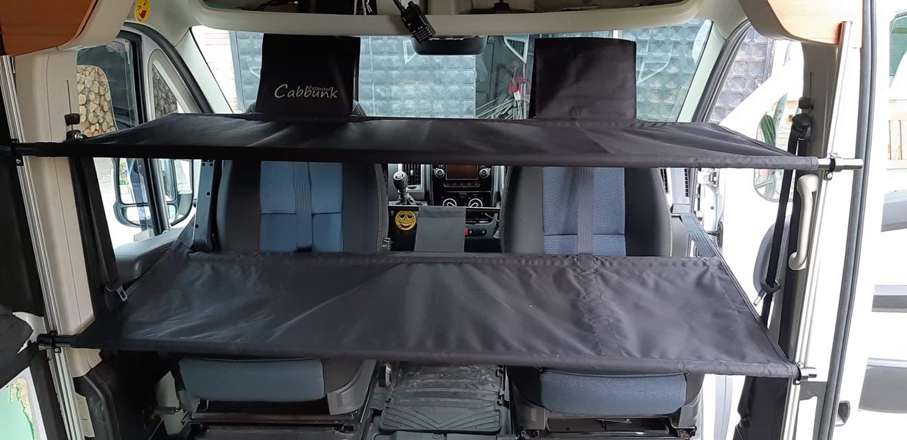 "Cabbunk" system: dual fabric bunks provide extra sleeping/storage in an rv rental's front cabin.. Mercedes Sprinter 2013