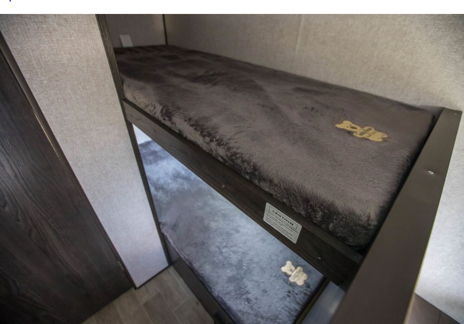 RV rental: Plush gray bunk beds with cute teddy bear accents, perfect for a cozy trip.. Dutchmen Coleman Lantern LT 2020
