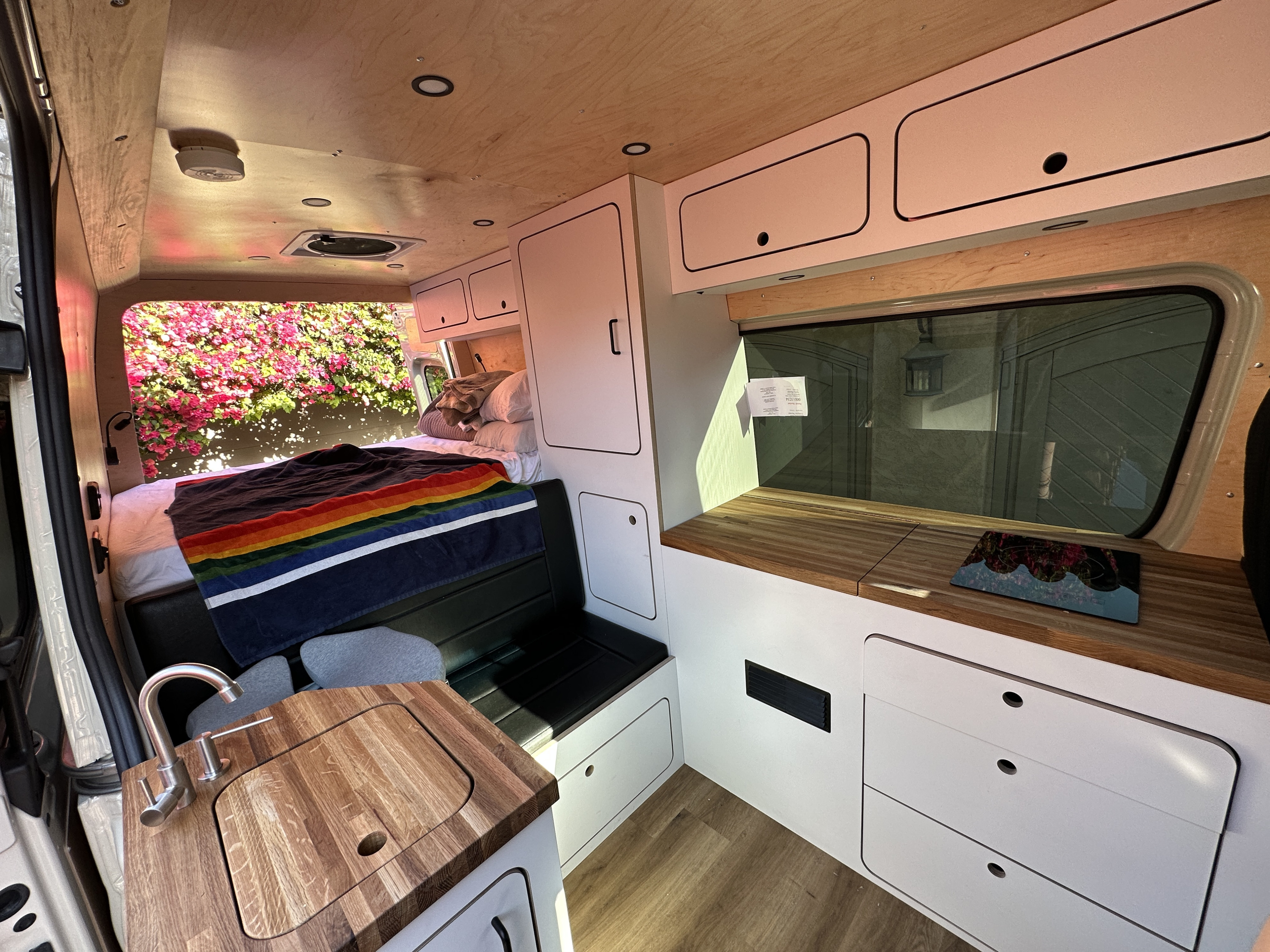 This inviting RV rental features a full bed, compact kitchen with sink, and custom cabinetry for comfortable travel.. VanCraft VanCraft Class B 2023