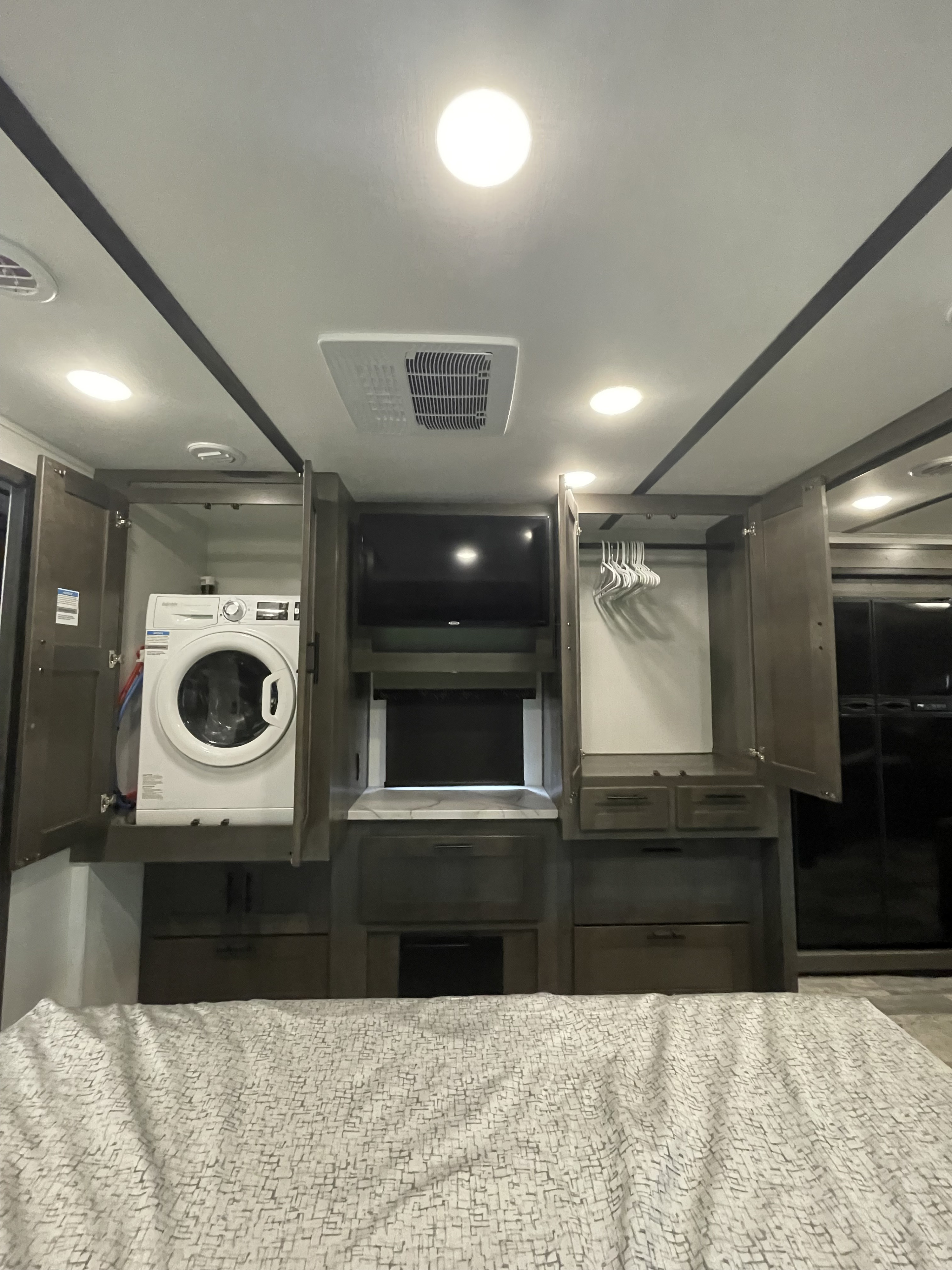 Spacious RV rental interior with integrated washer, TV, and closet for convenience on the road.. FR3 FR3 Motorhome 2023