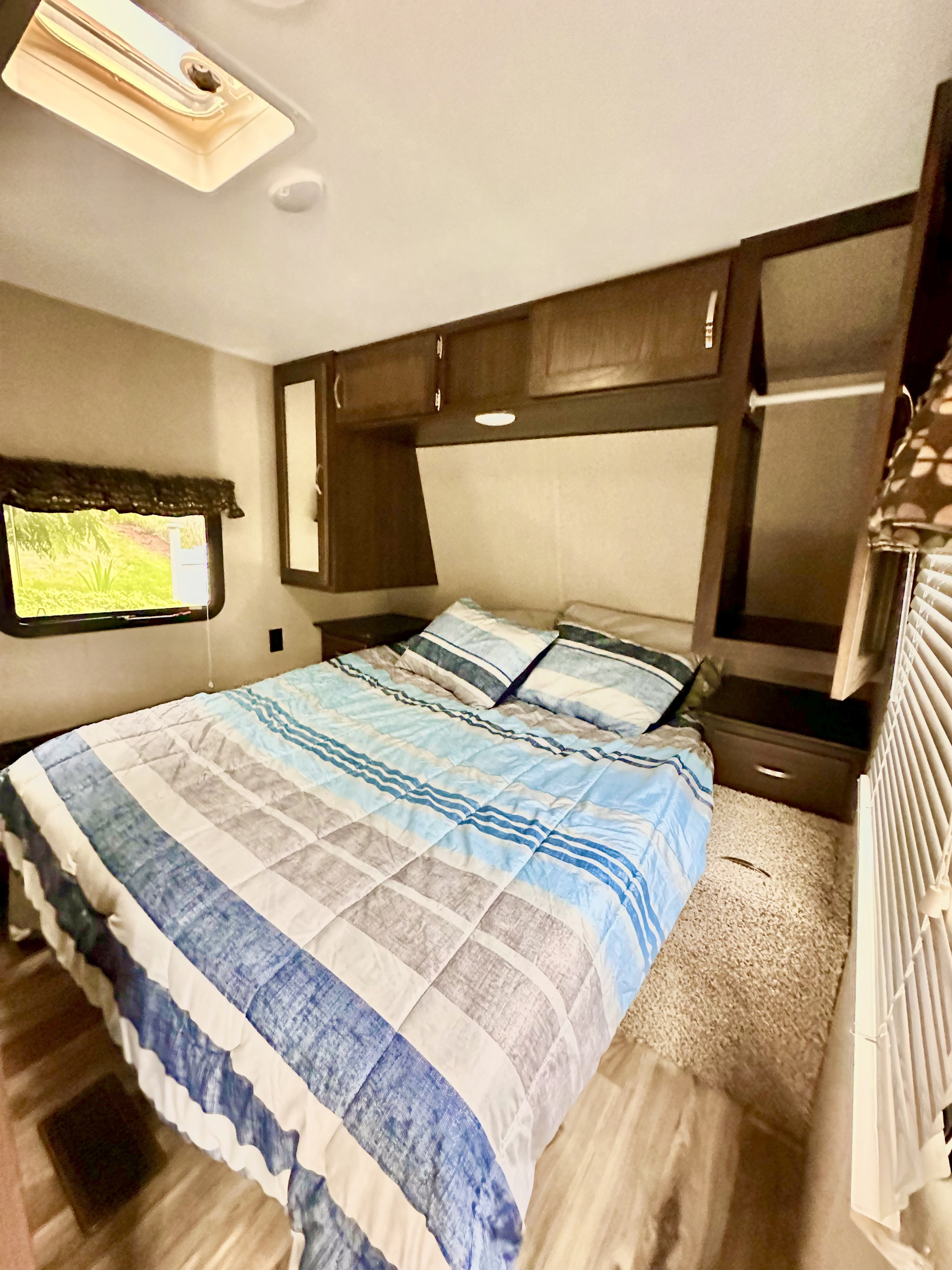 Queen bed with 4" gel memory foam mattress topper. . Keystone RV Springdale 2018