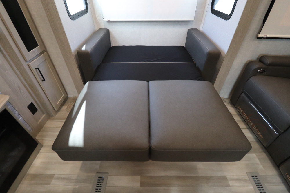 This RV rental features a versatile sofa that converts into a comfortable bed, optimizing space in your travel home.. Forest River Rockwood Signature Ultra 2021