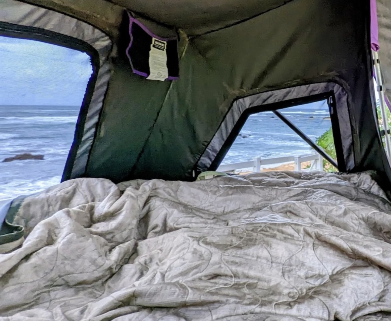 Inside a comfy RV rental rooftop tent, overlooking waves & a beach. Perfect oceanfront glamping spot awaits!. Other Other 2019