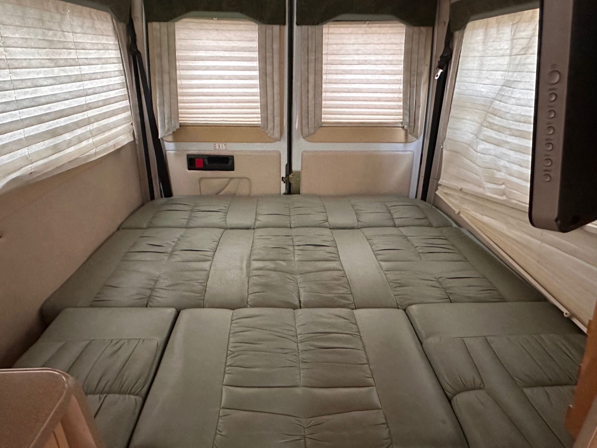 RV rental: The rear interior features a versatile fold-down bed, side windows with blinds, and an emergency exit.. Leisure Travel Vans Leisure Travel Vans Class B 2005