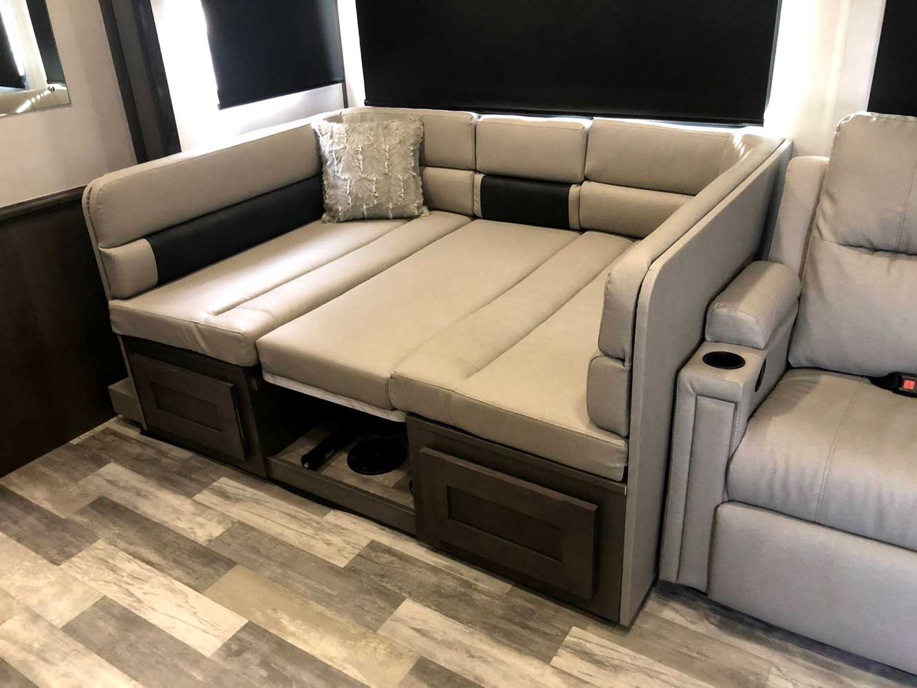 Experience comfort in this RV rental! Versatile L-shaped dinette transforms into a spacious bed with under-seat storage.. Forest River FR3 30DS 2023