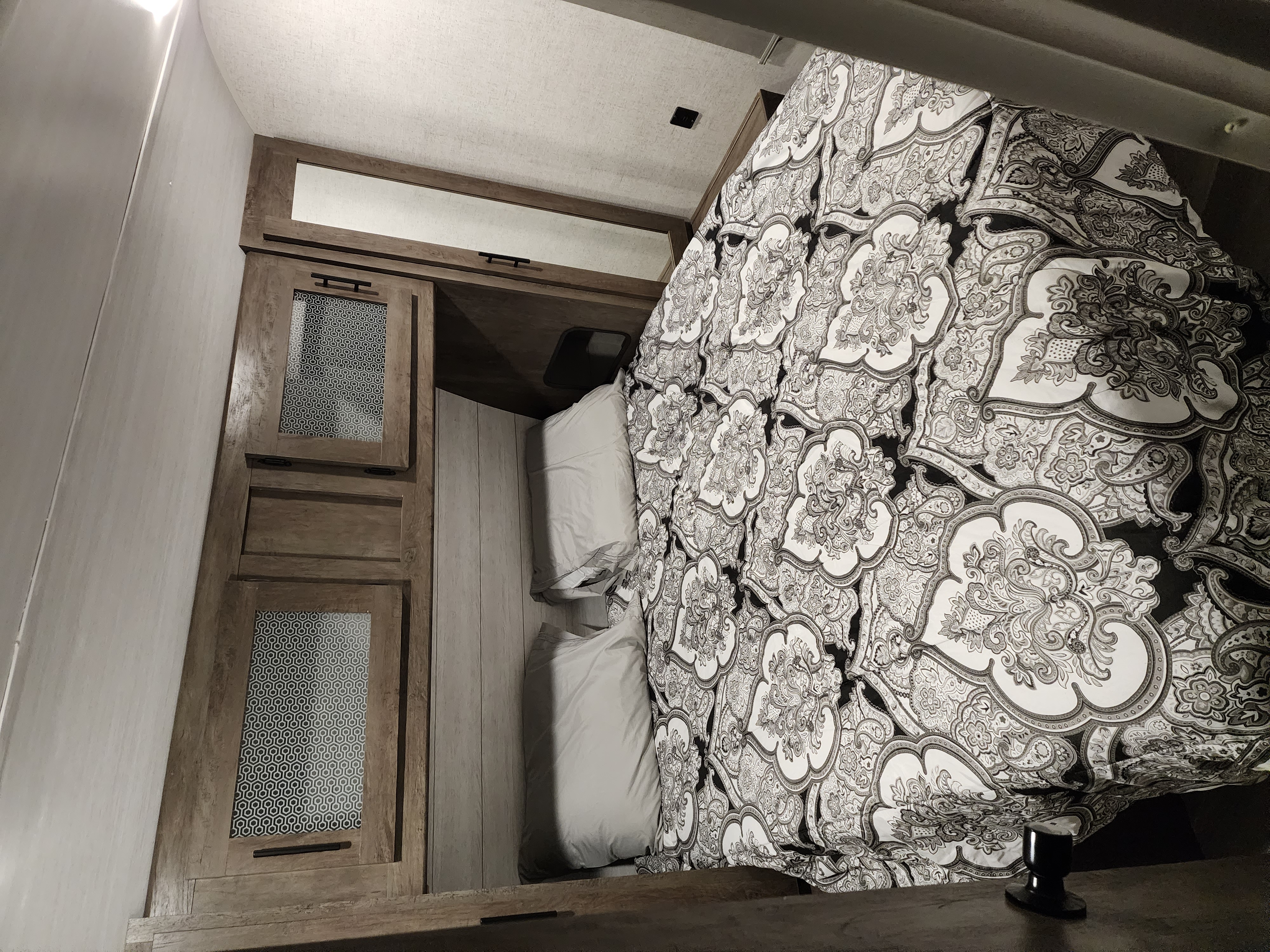 Large Master Bedroom with Queen bed and storage on top, on the sides, and below. All bedding is included!. Forest River Wildwood 2021