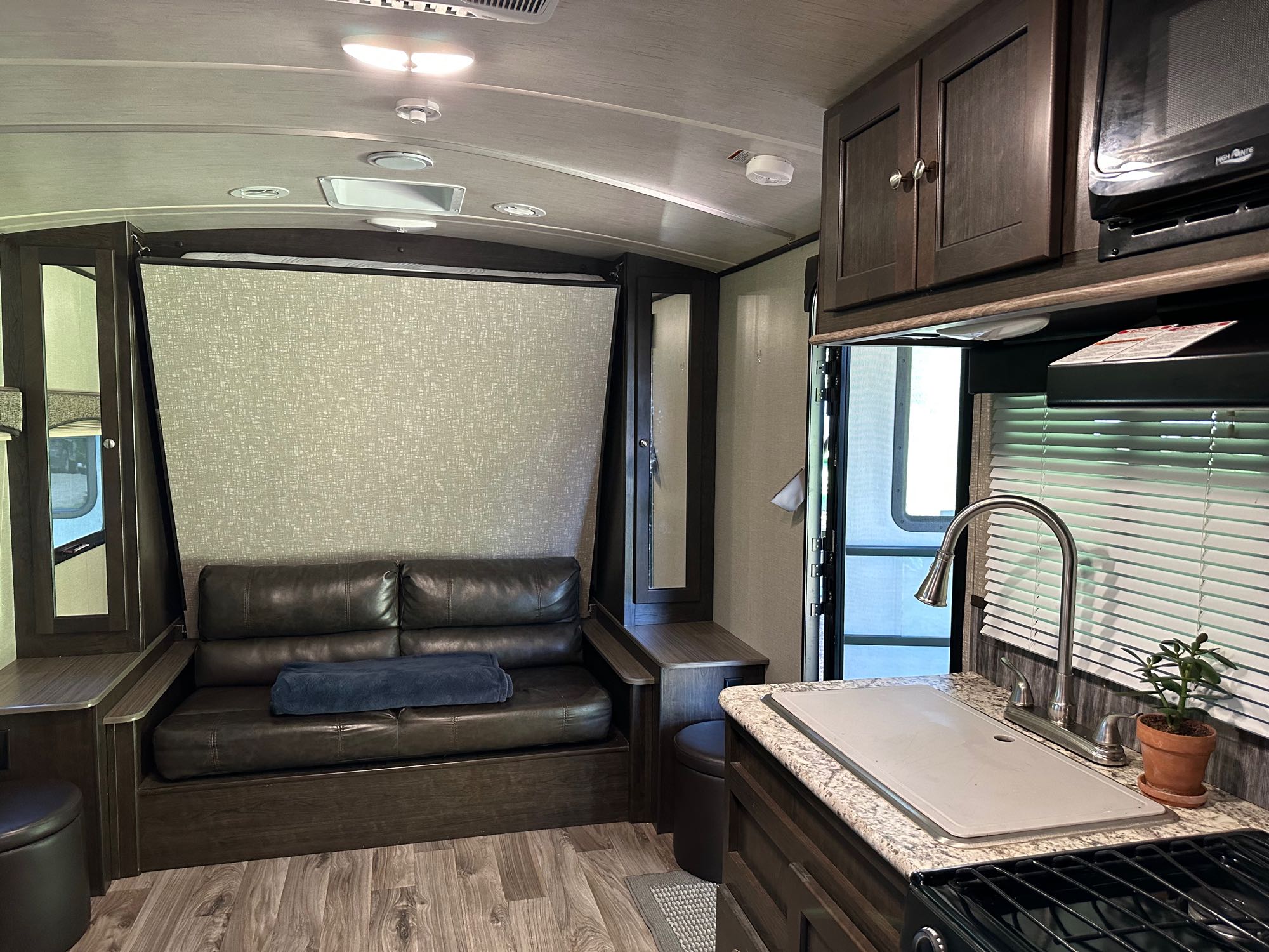 Couch converts to queen sized bed . Heartland RVs Sundance 2018