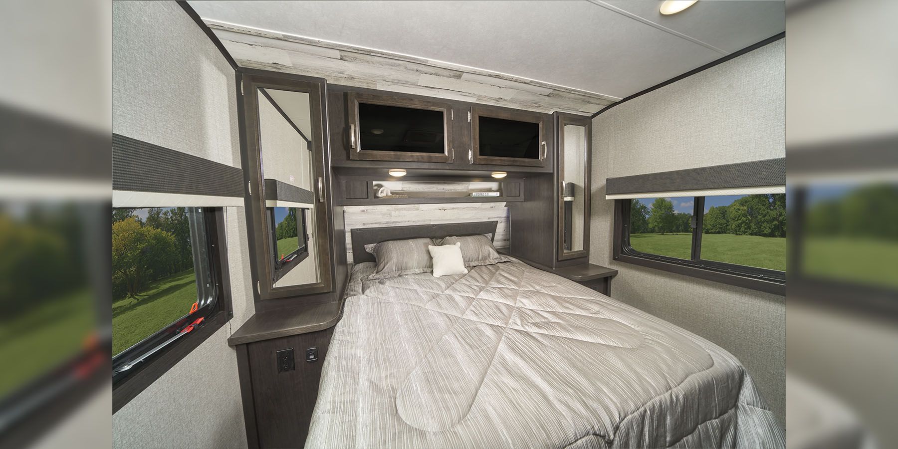Experience comfort in this RV rental bedroom. Features a cozy bed, ample storage, and scenic windows for your travels.. Jayco Jay Feather 2021