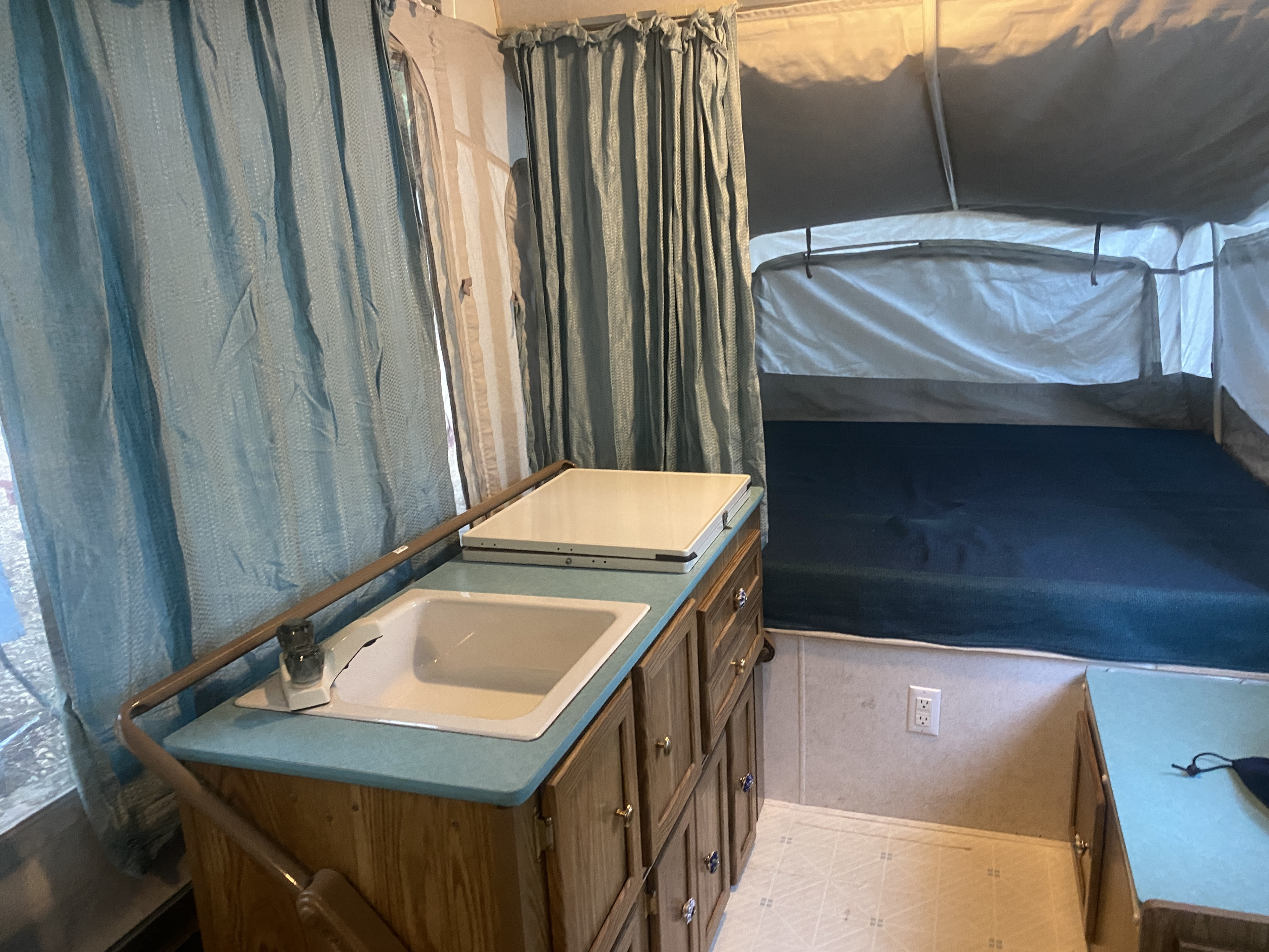 Queen bed. When you walk in and look to the right this is the view. . Coleman Pioneer Arcadia 1994