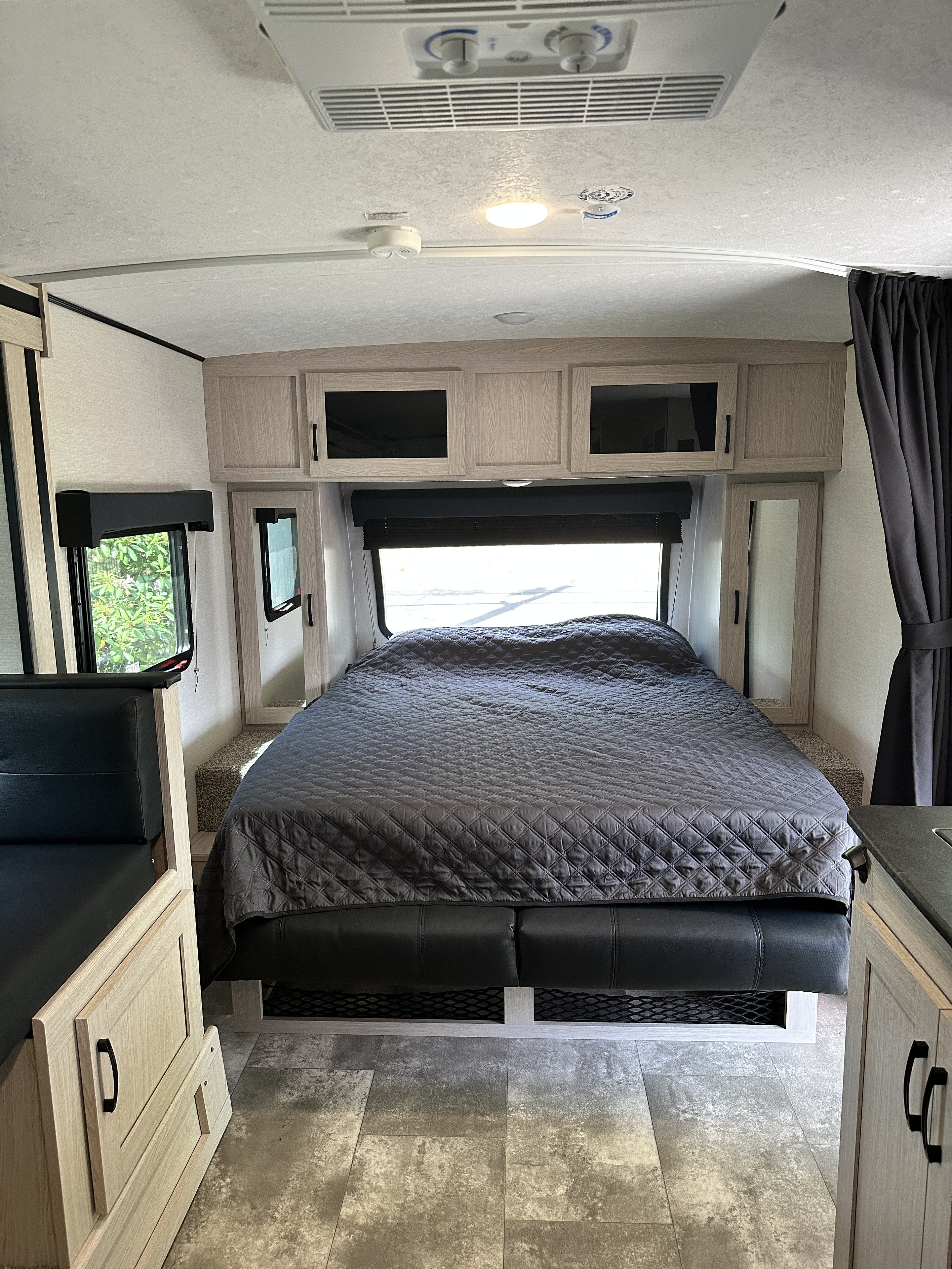 Experience comfort in this rv rental. View of the bed, dining nook, and ample storage for your next road trip.. Coachmen Apex Nano 2022
