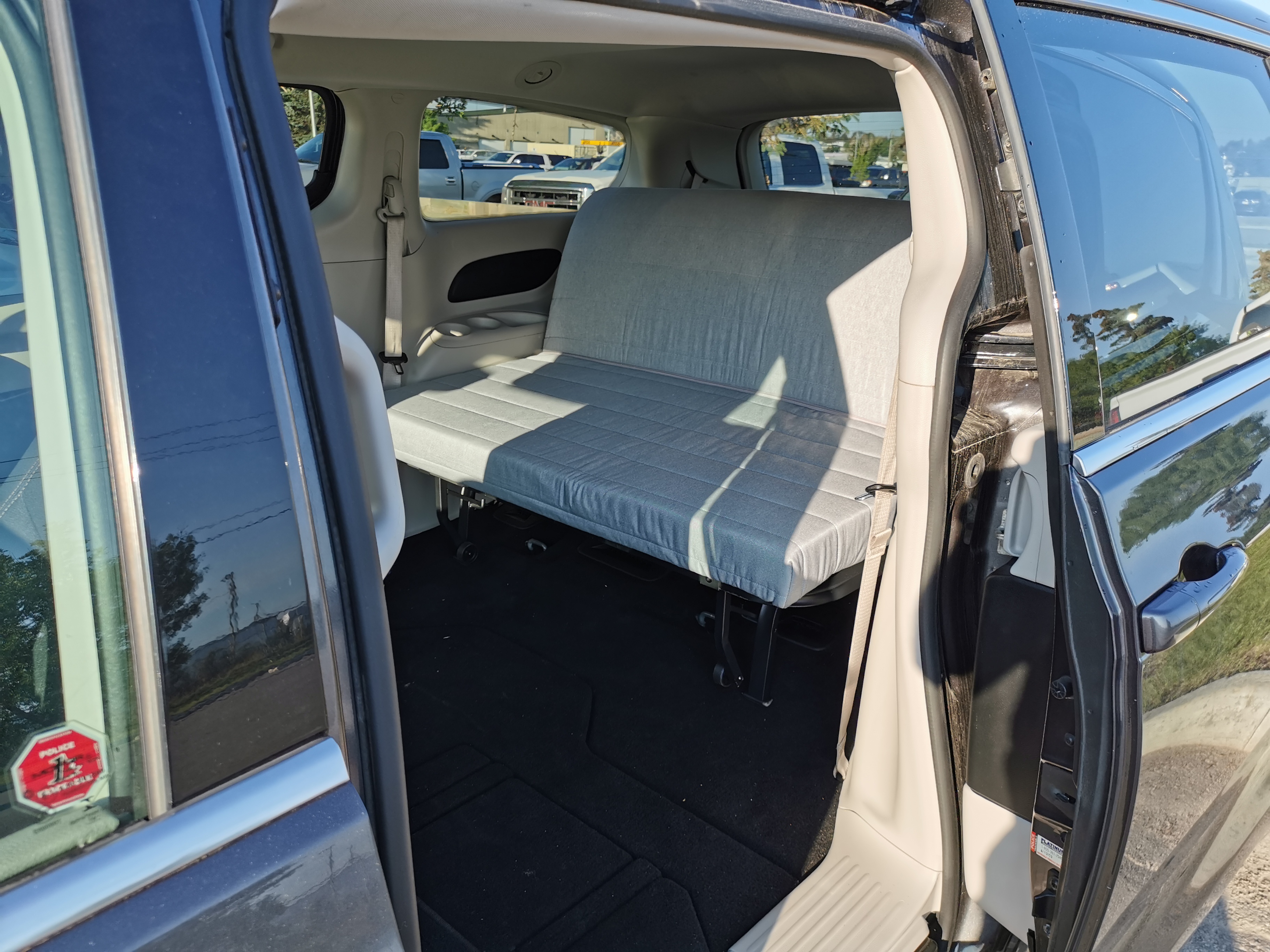 RV rental ready: Minivan interior with a comfortable fold-out bed, ideal for your next adventure.. Chrysler Pacifica 2017