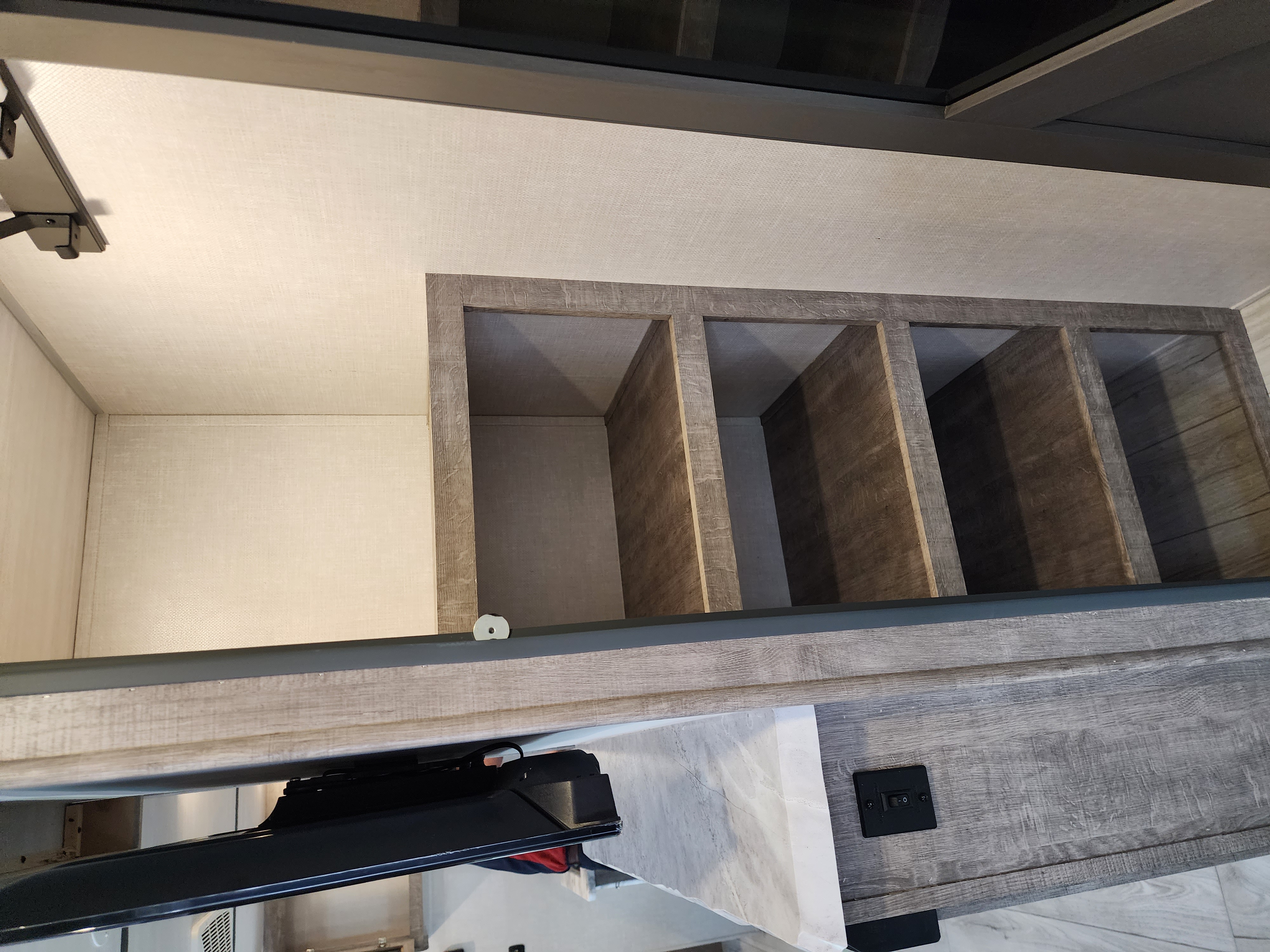Modern RV rental bunk area with storage cubbies and sleek finishes.. Forest River Grand Surveyor 267RBSS 2023