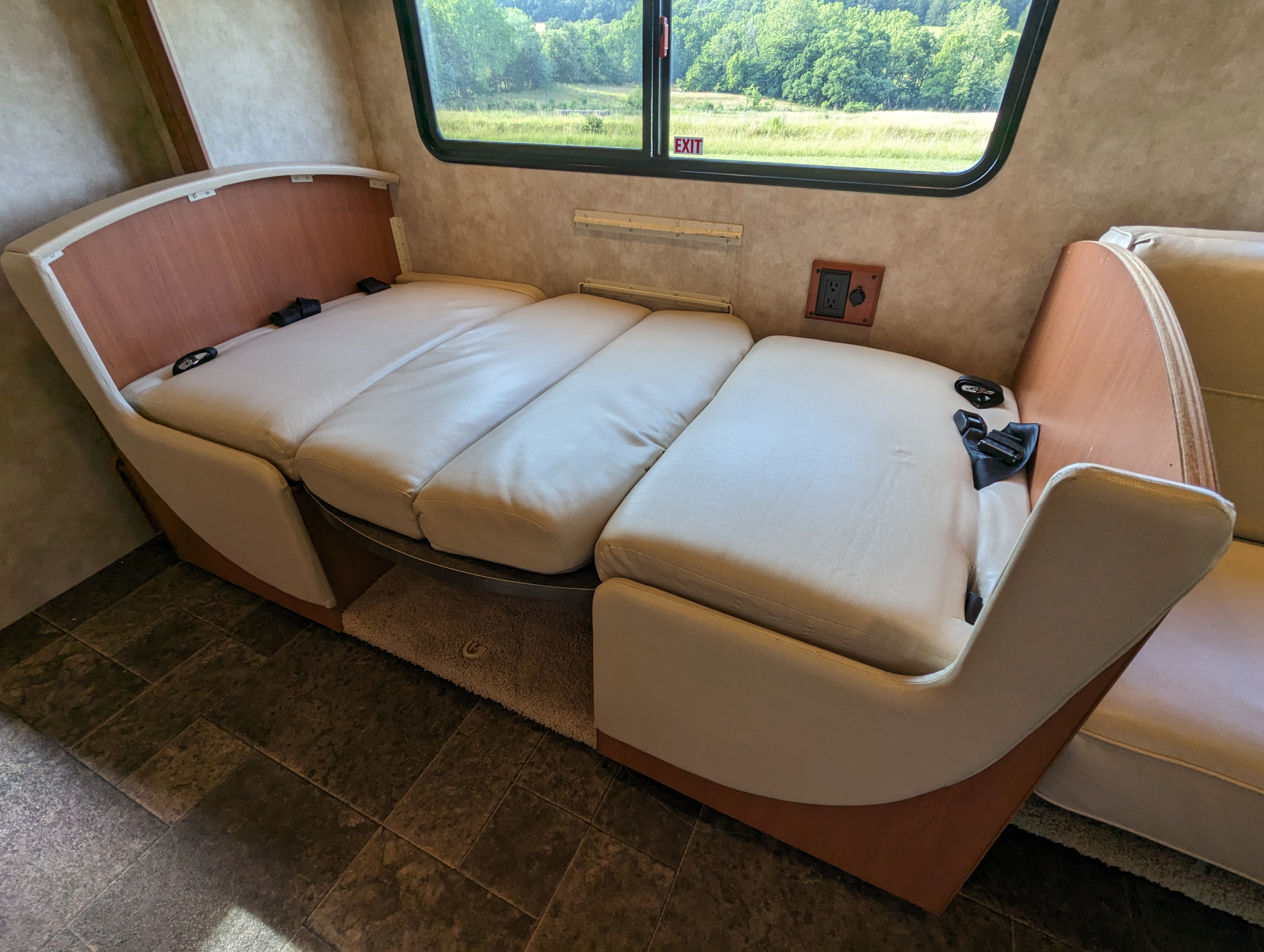 Dinette converted into a bed. Itasca Navion 2012