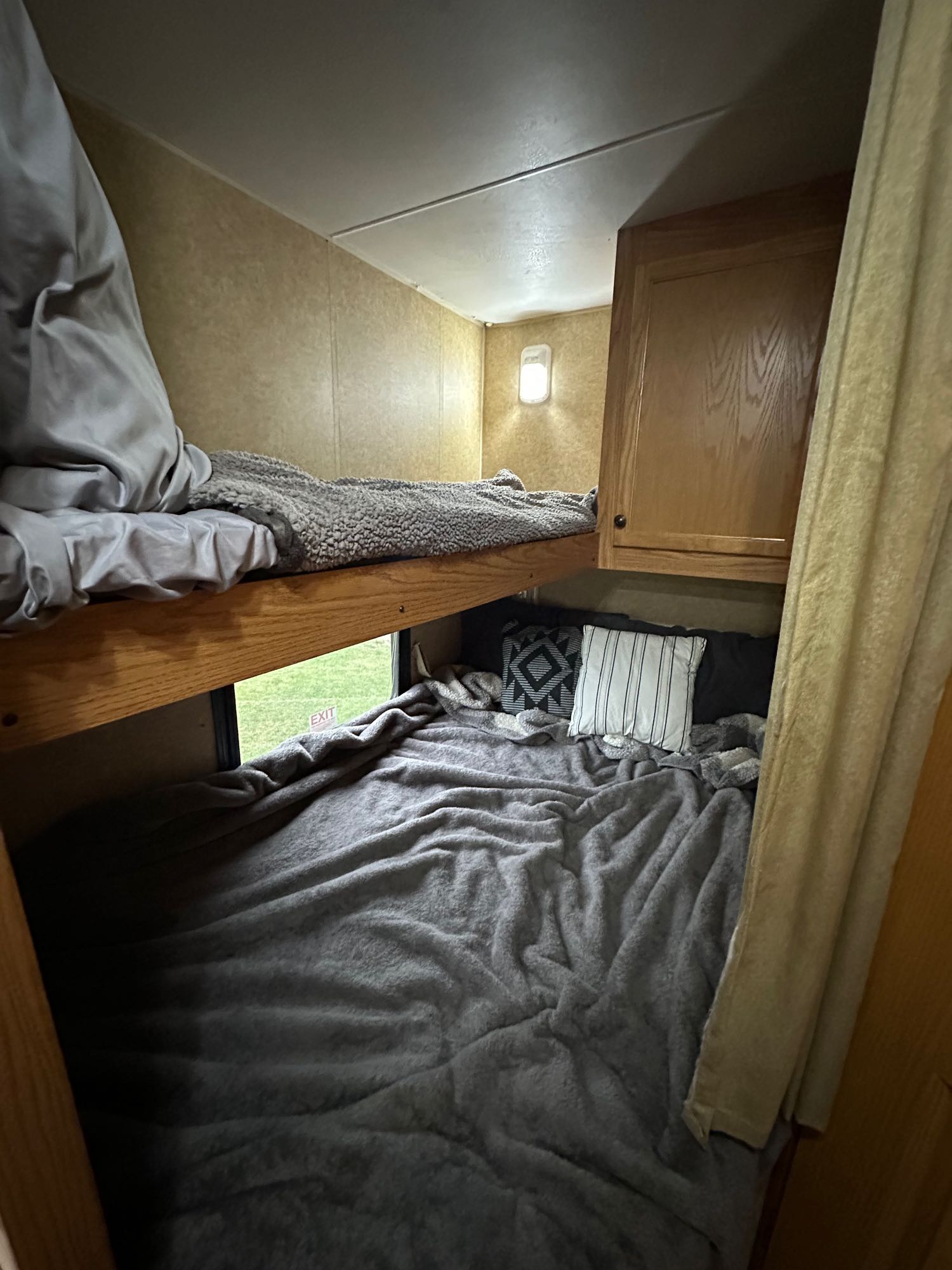 Bunks - there is a light in each area and blinds for the window. Twin on top and full on bottom. . Heartland RVs Trail Runner 2011
