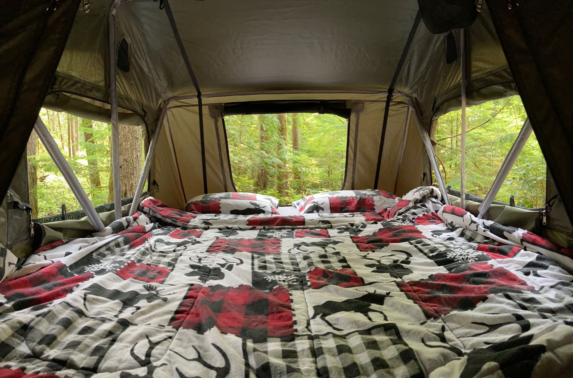 Relax in this cozy tent bed, featuring moose & plaid, with a stunning forest view. Great for your RV rental adventure!. Subaru Outback 2015