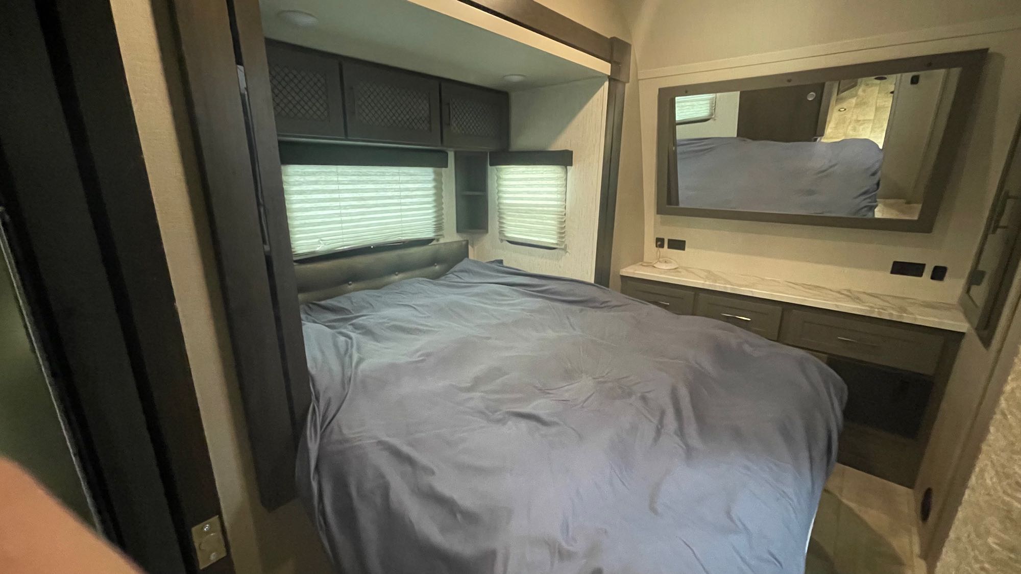 Queen size bed in master slide out. Grand Design Momentum 2022