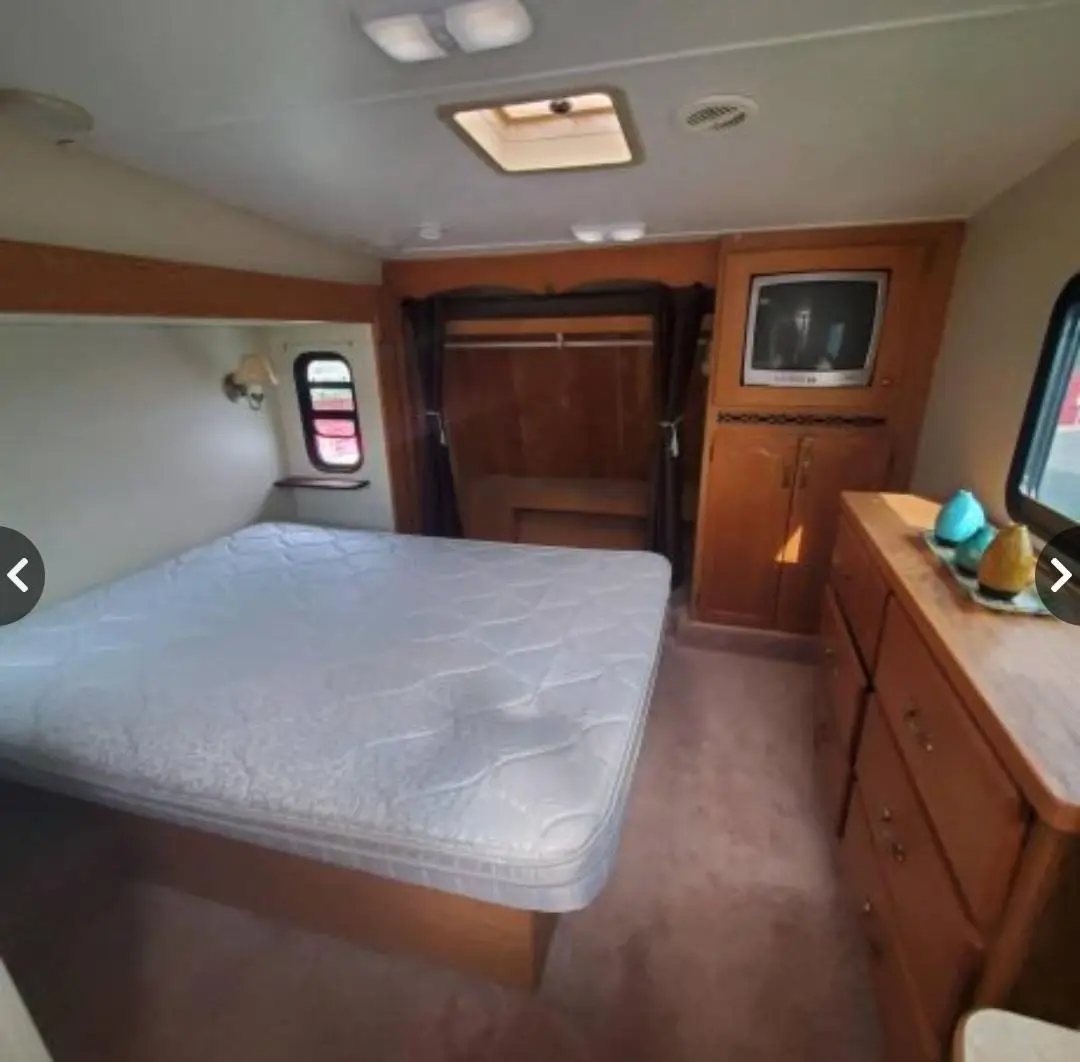 Slide out with Queen bed, storage beneath. Dresser, closet, TV, and more storage.. Keystone RV Montana 2007
