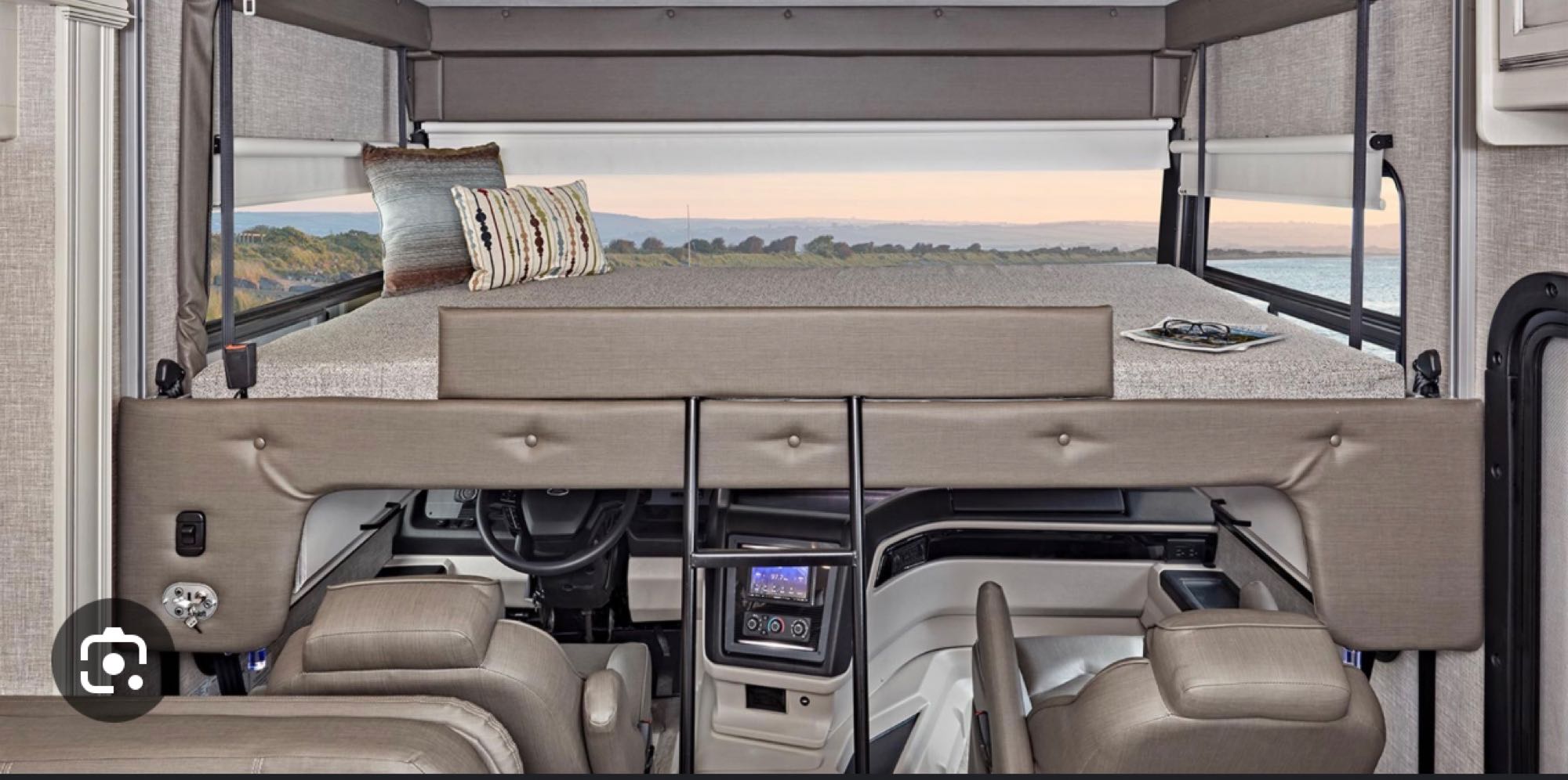 This RV rental offers a comfortable cab-over bunk bed with scenic ocean views. Driver's cockpit is below.. Jayco Alante 29F 2023